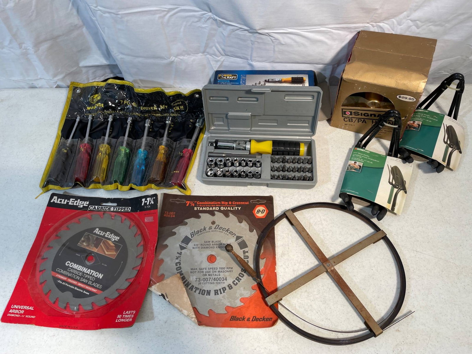Hand Tools, Circular Saw Blades, Bike Hooks, and Signal CB Horn: This lot includes a variety of items: a set of Workzone 7-piece screwdriver set (#93405), two carbide-tipped circular saw blades (Acu-Edge 7 1/4 inch and Black & Decker combination rip & crosscut blad