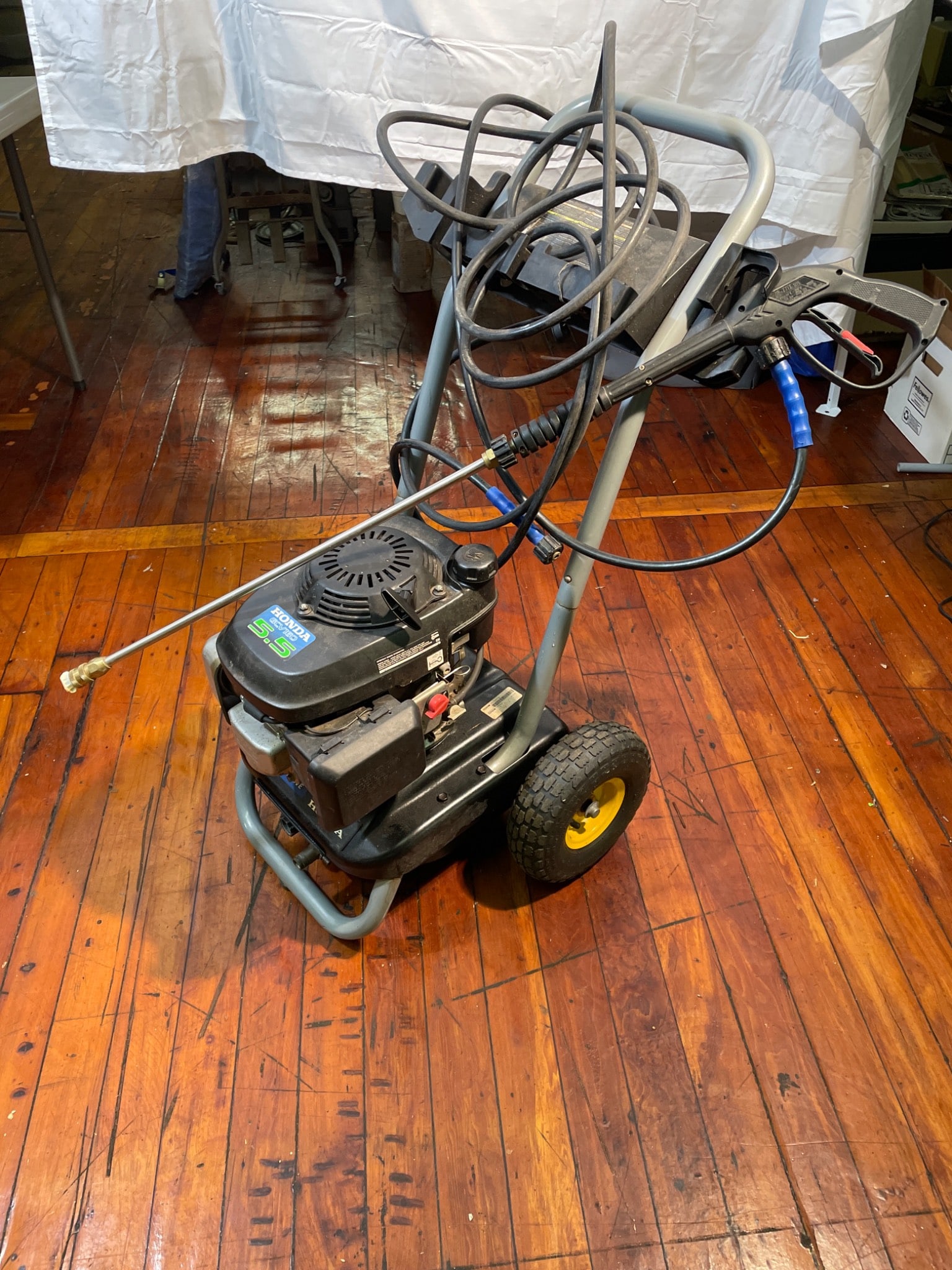 Pressure Wave PWH2500 Gas-Powered Pressure Washer, 2500 PSI, 5.5 HP: Pressure Wave PWH2500 gas-powered pressure washer with a Honda 5.5 HP engine. The unit outputs up to 2500 PSI at 2.2 gallons per minute. Features include a wand with nozzle attachment and a mobility f