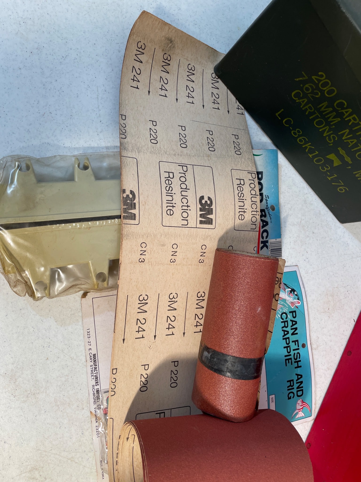 Items Including M80 Ammo Box, Fishing Gear, and 3M Sandpaper - 2