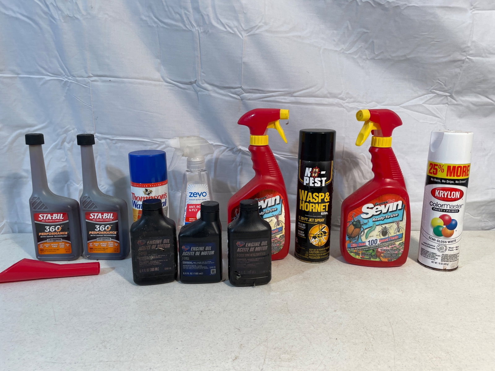 Miscellaneous Household Chemicals and Sprays, Including STA-BIL, Krylon, and SEVIN: This lot includes a variety of household chemicals and sprays: (2) STA-BIL 360 Performance Fuel Stabilizer bottles, (1) Thompson's WaterSeal Aerosol Spray, (1) Zevo Ant Roach Spray, (1) SEVIN Ready-to