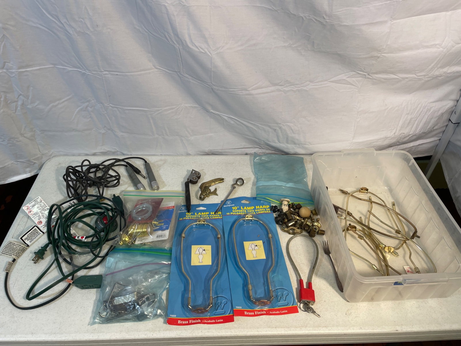 Lamp Repair Lot With Components and Hardware: This lot includes a variety of components for lamp repair, including two 10-inch lamp harp sets in brass finish (model T004), wiring components, hardware, and a selection of lamp repair parts. Items