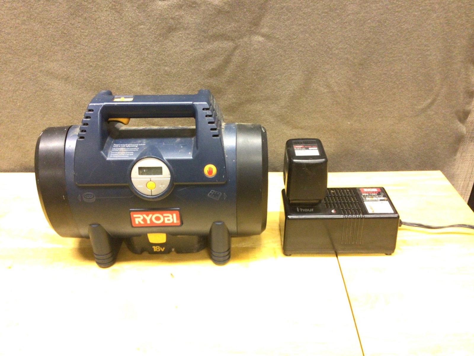 Ryobi 18V Cordless Inflator with Battery, Charger, and Accessories: This Ryobi 18V cordless inflator includes the inflator unit, an 18V NiCad battery, a 1-hour charger, and hose accessories. The inflator features an integrated pressure gauge and an attached hose for i
