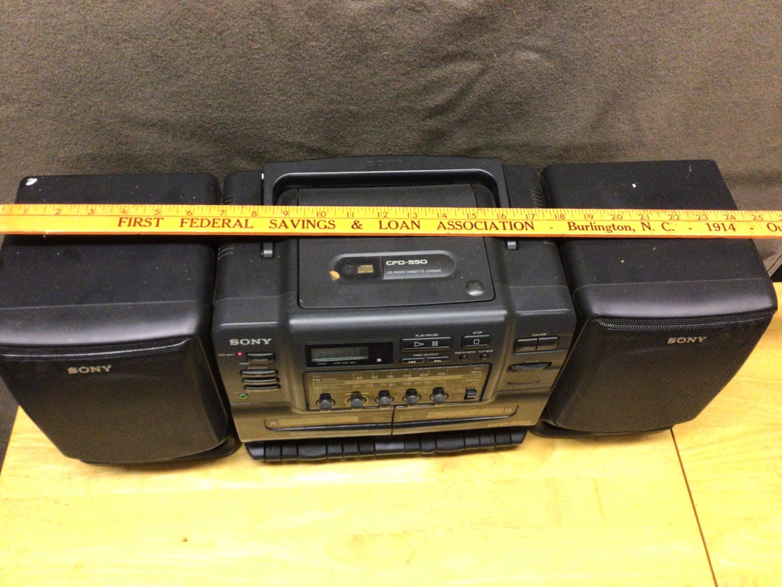 Sony CFD-S22 CD Radio Cassette-Corder Boombox With Detachable Speakers: This is a Sony CFD-S22 CD Radio Cassette-Corder Boombox. Features include a top-loading CD player, AM/FM radio, cassette player, and detachable speakers. The model is compact with integrated controls