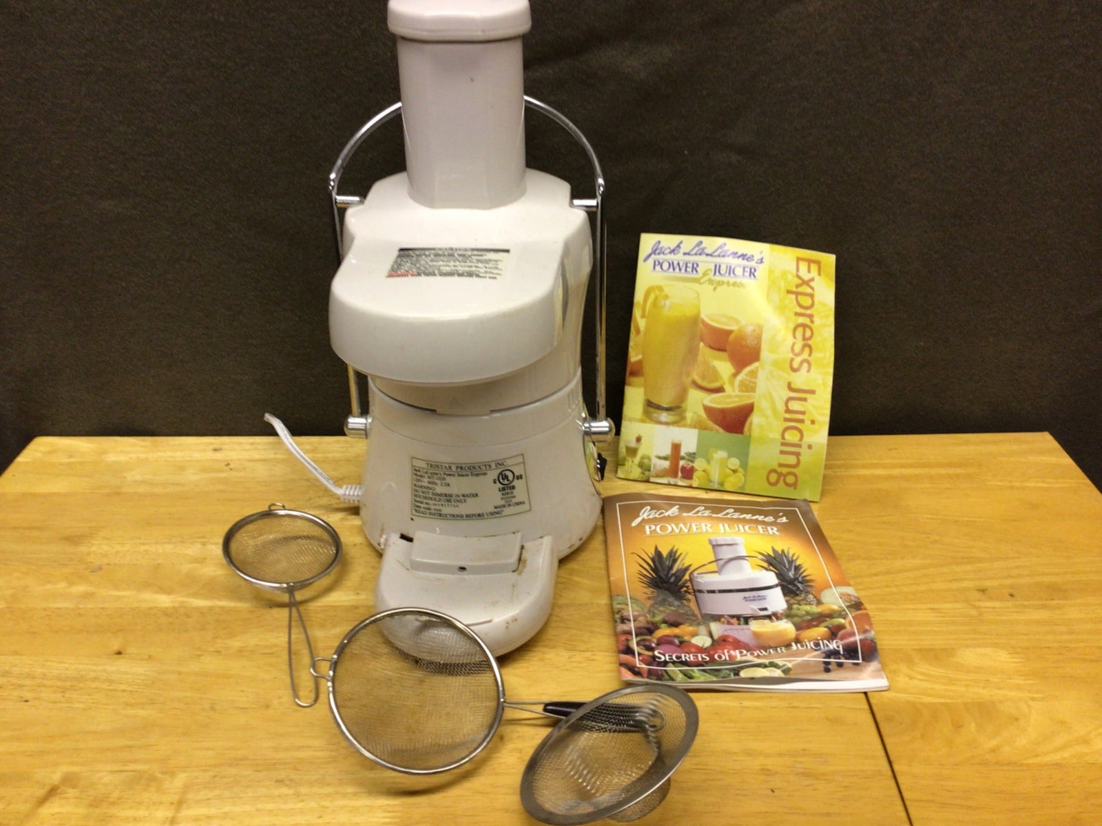 Jack LaLanne's Power Juicer Express with Accessories and Manuals: This listing includes a Jack LaLanne's Power Juicer Express, complete with three strainer accessories and two manuals (Express Juicing and general Power Juicer guide). The juicer appears to be in