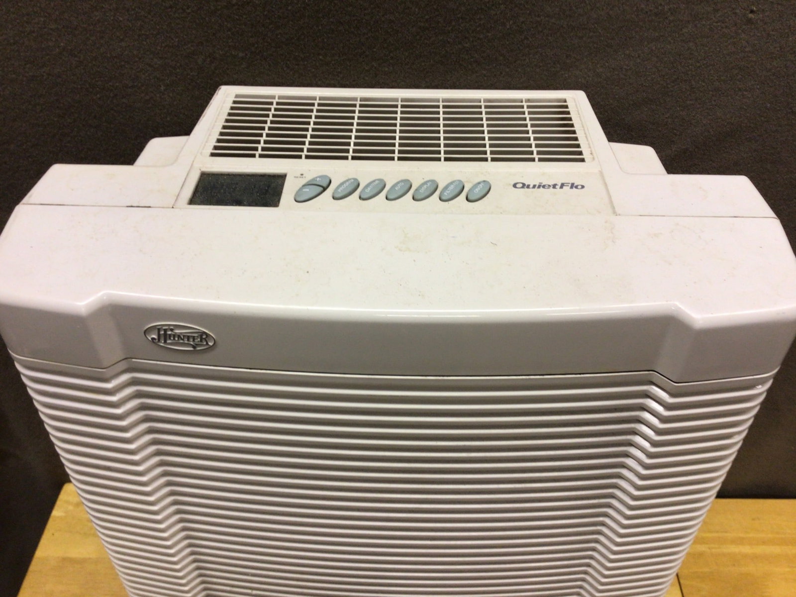 Hunter QuietFlo Air Purifier Model 30090 with Control Panel: Hunter QuietFlo air purifier, model 30090. The unit includes a digital display and multiple buttons for various settings. Designed for efficient air purification. Measurements approximately 21 inches