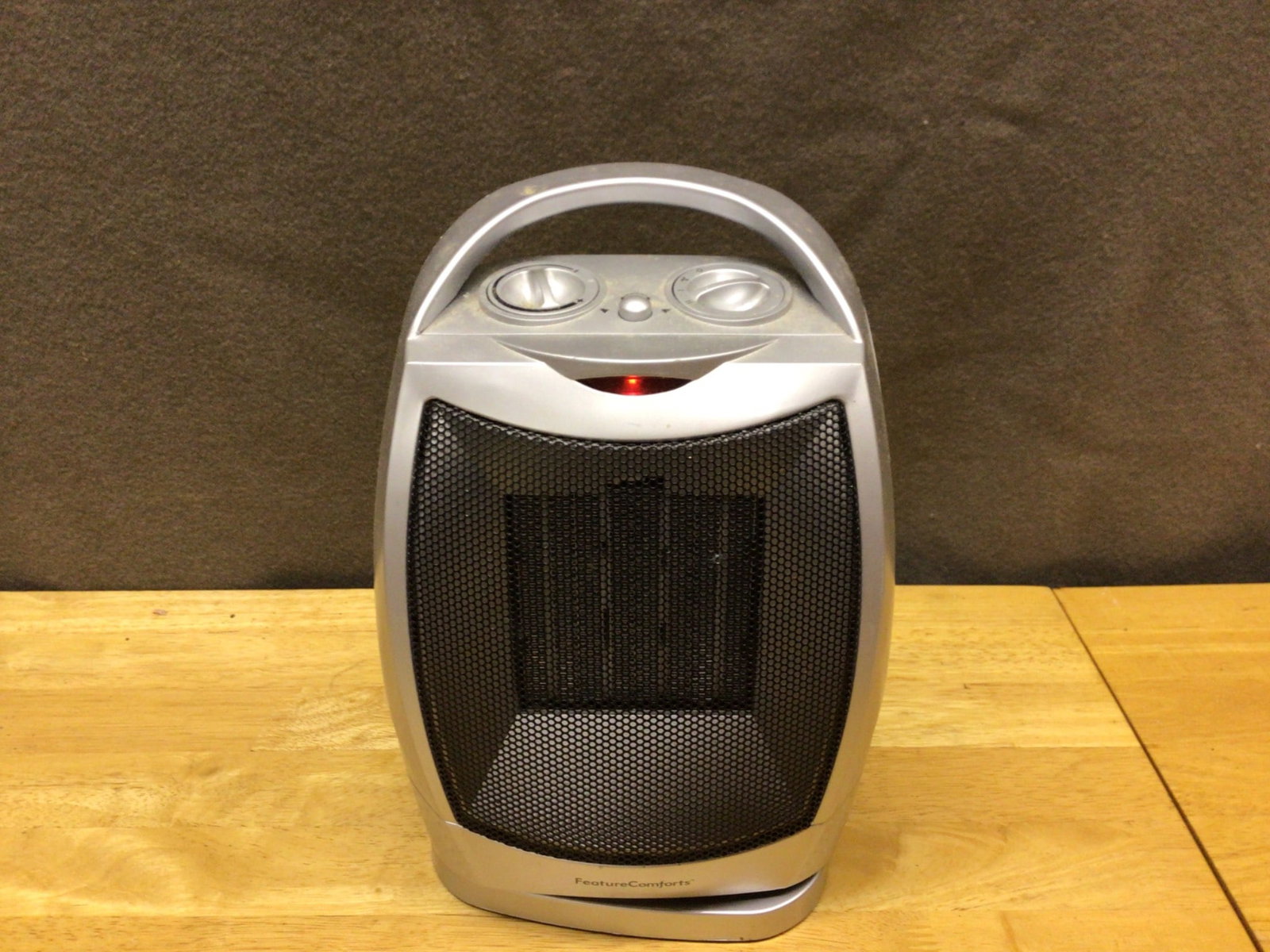 Feature Comforts Portable Oscillating Space Heater with Adjustable Controls: This is a Feature Comforts portable space heater with oscillating functionality and adjustable controls. The unit is equipped with dual rotary dials for adjusting temperature and oscillation