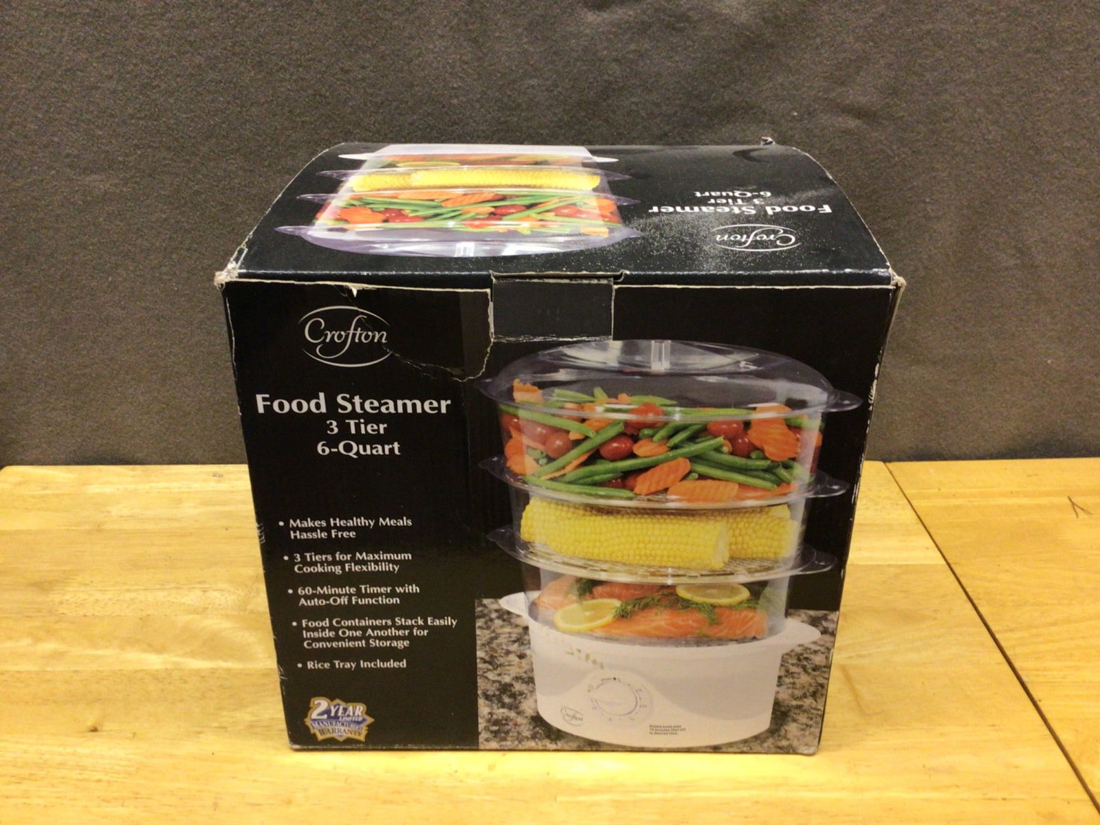 Crofton Food Steamer 3-Tier 6-Quart Model 57651-11: Crofton 3-Tier Food Steamer with a total 6-quart capacity. Model number 57651-11. Features an auto-off timer and stackable containers for convenient storage. Includes a rice tray. Item appears to be