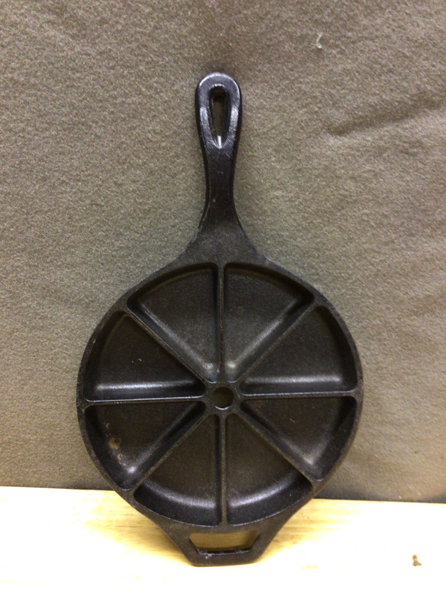 Cracker Barrel Divided Cast Iron Skillet with 6 Sections: This is a Cracker Barrel cast iron skillet featuring 6 triangular sections, designed for portioned cooking. The skillet bears the Cracker Barrel logo on the underside and measures approximately 10 inc