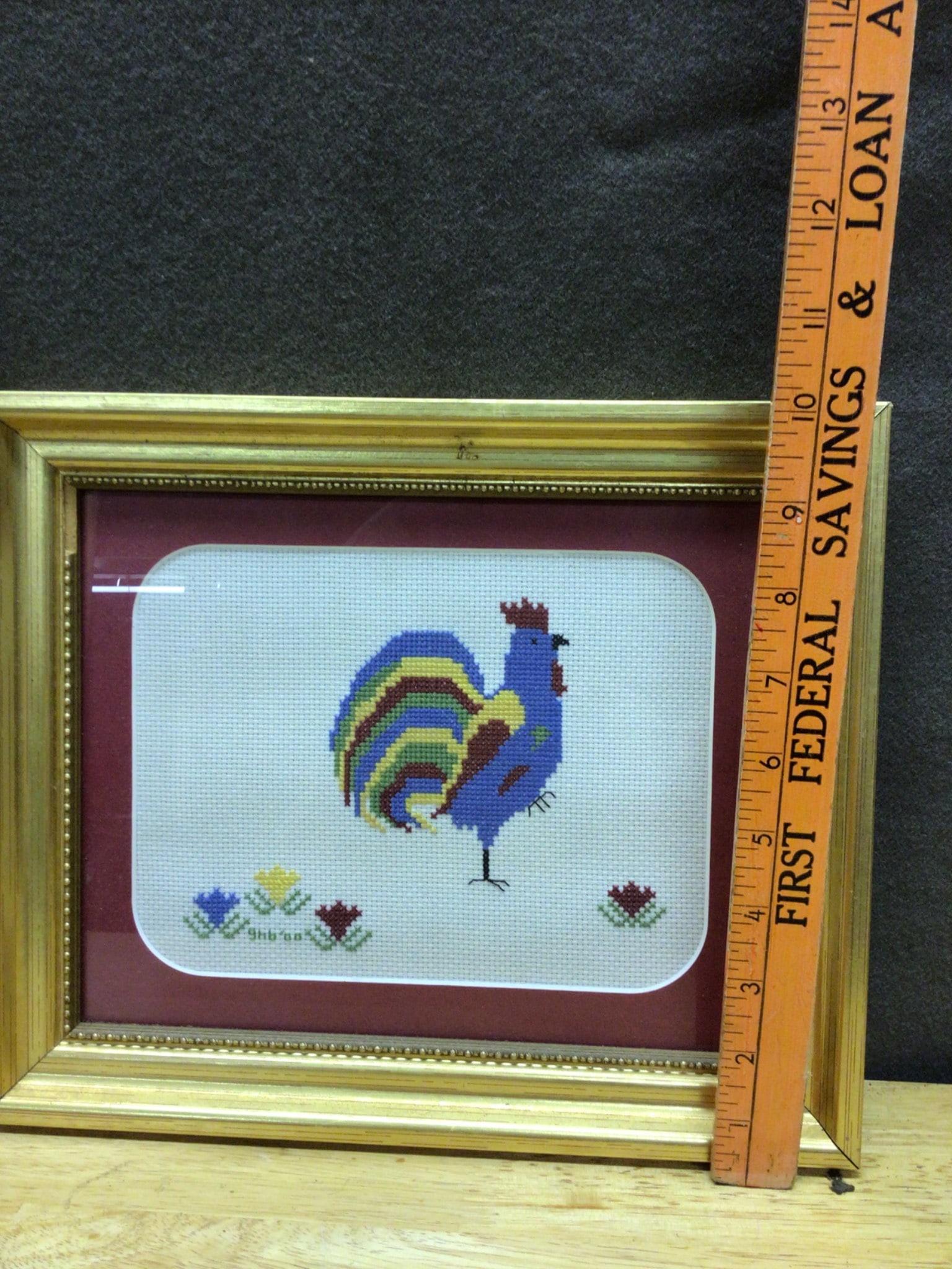 Framed Needlepoint Artwork Featuring Multicolored Rooster with Gold Frame: This lot consists of a framed needlepoint artwork featuring a multicolored rooster. The piece is housed in a gold-colored wooden frame with glass protection. Art dimensions are approximately 6.5 x