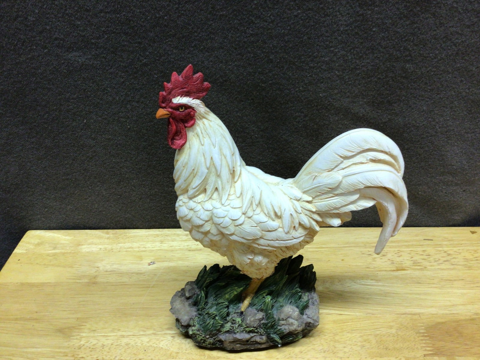Decorative Resin Rooster Figurine With Base, Approximately 8 Inches Tall: A decorative resin rooster figurine standing on a grass-styled base. The item measures approximately 8 inches in height based on accompanying size reference. The bottom includes a label that reads
