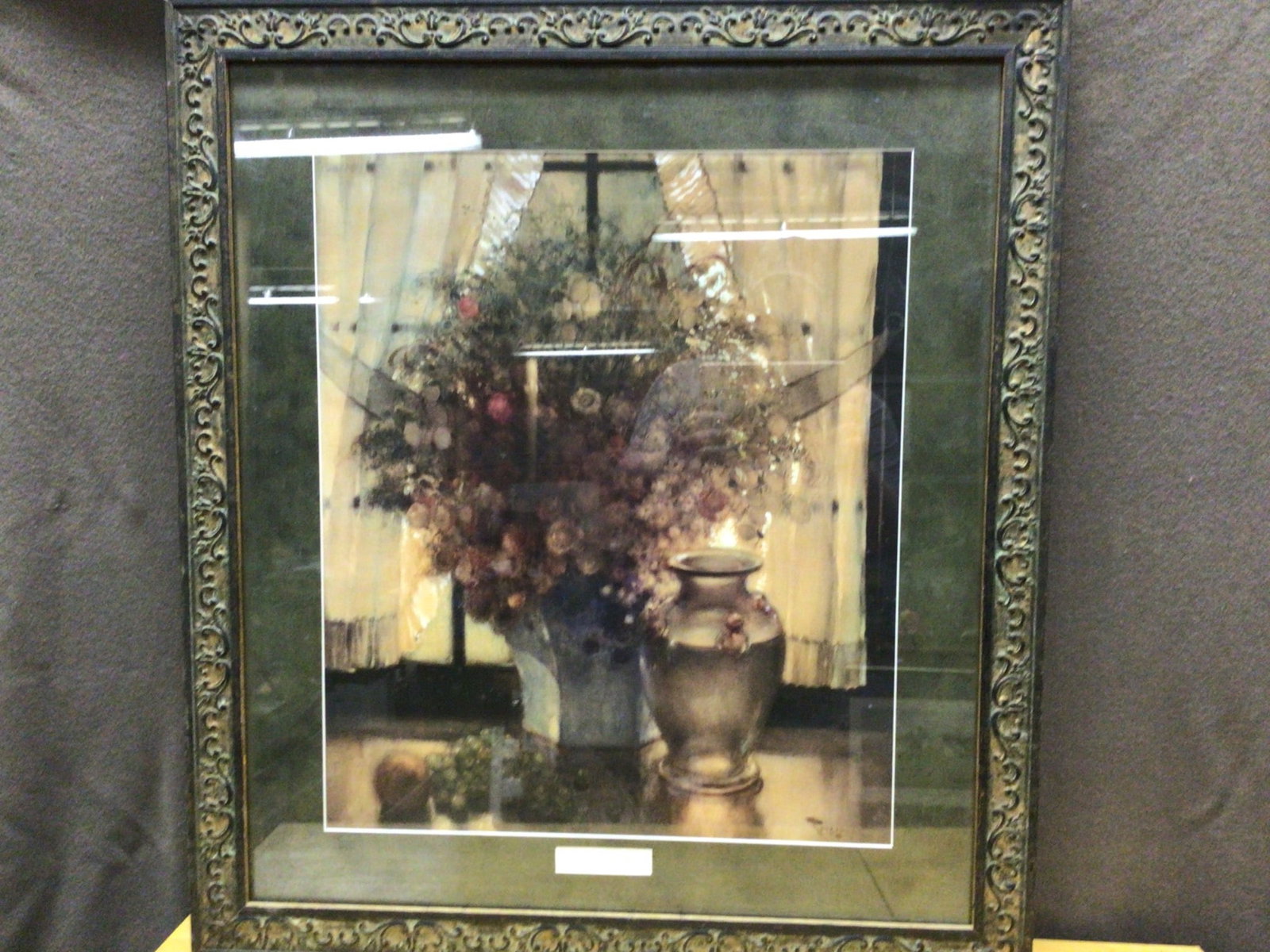 Summer Still Life by Bernard Toussaint (1873-1955), Framed Artwork: Framed piece titled 'Summer Still Life' by Bernard Toussaint (1873-1955). The artwork is presented in a decorative frame featuring an intricate pattern. Approximate dimensions, including the frame, ar
