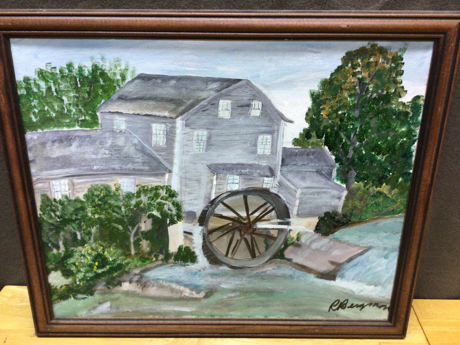 Original Landscape Painting of Mill and Water Wheel by R. Benjamin: This is an original acrylic landscape painting signed by R. Benjamin, showcasing a mill building with a water wheel surrounded by trees and a flowing stream. The framed artwork measures approximately 