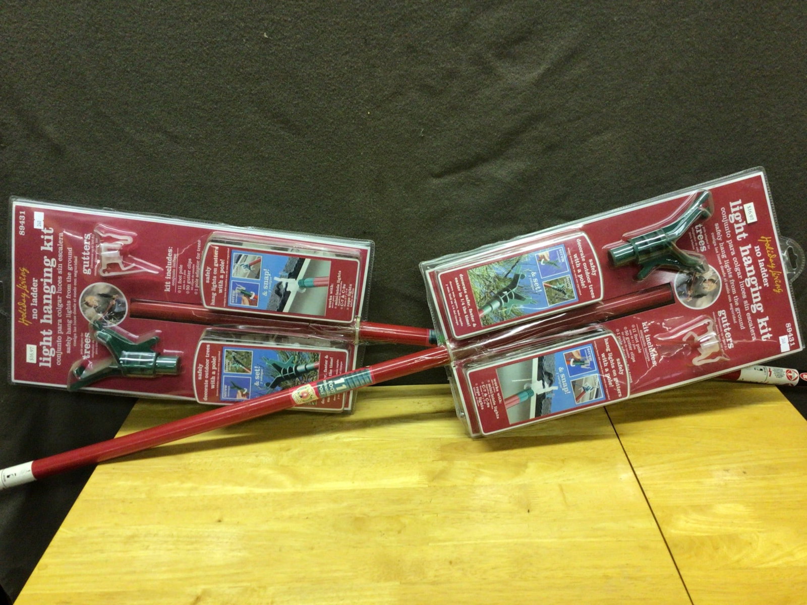 11-Foot Light Hanging Kit With Accessories For Trees And Gutters: This lot includes two unopened 11-foot light hanging kits. Each kit contains an 11-foot pole, tree and gutter light attachment heads, and 50 gutter clips. The kits are designed for safely hanging