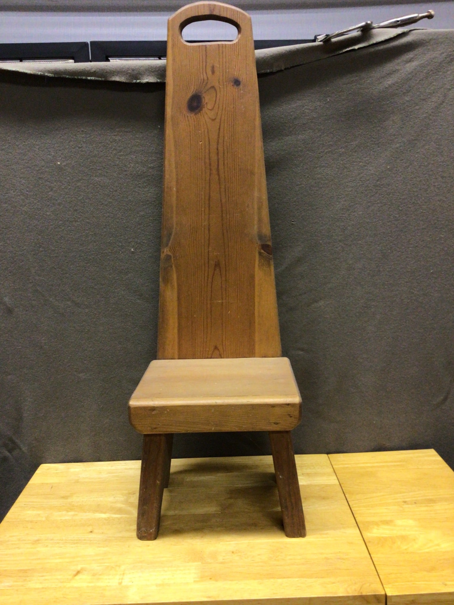 Handcrafted Wooden Stool with Backrest, 38 Inches Tall and 12 Inches Wide: This handcrafted wooden stool features a tall backrest and a sturdy rectangular seat. The dimensions are 38 inches in height and 12 inches in width. The item showcases visible wood grain and natural