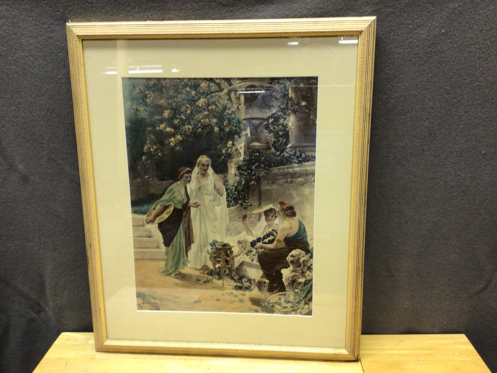 Framed Artwork by H. Schram Dated 1923 with Glass Covering: This is a framed artwork signed by H. Schram and dated 1923. The piece is mounted under glass and features a beige mat and a gold-toned frame with decorative edging. The art, likely a print or