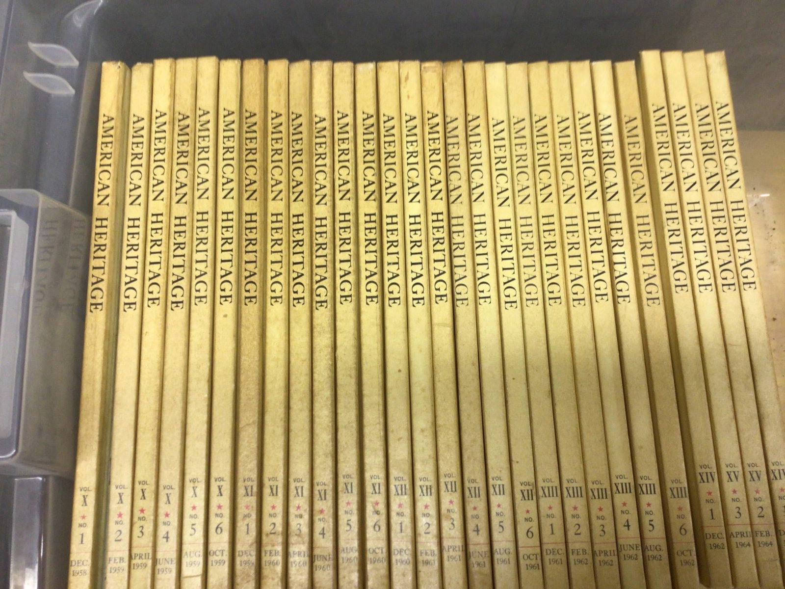 American Heritage Hardcover Volumes, 1958-1961: The 'American Heritage' magazine bound hardcover volumes, covering various issues from 1958 to 1961. Includes volumes labeled X-I through XIV-2. Each volume is sequentially numbered and dated,