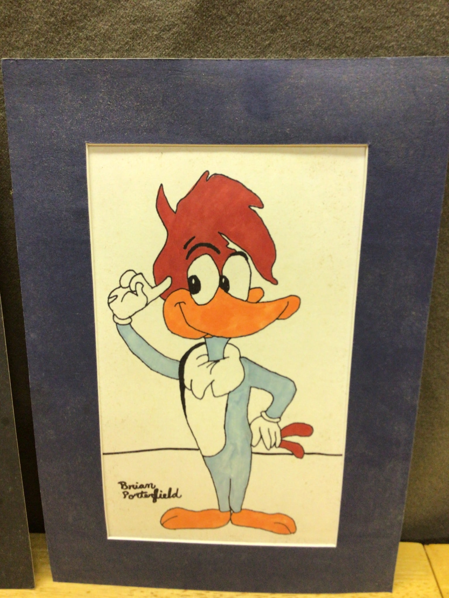 Two Hand-Drawn Cartoon Illustrations Signed by Brian Porterfield: Two framed hand-drawn cartoon illustrations signed by Brian Porterfield. Each piece measures approximately 10 in x 8 in as shown, including frames. Depicts expressions of anthropomorphic cartoon