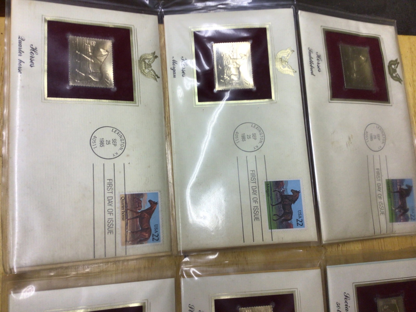 First Day Covers with Inset Gold Replicas (1985-1986): This lot includes a series of First Day Covers issued between 1985 and 1986, featuring gold foil stamp replicas inset into the covers. The covers commemorate various themes, such as horses, the