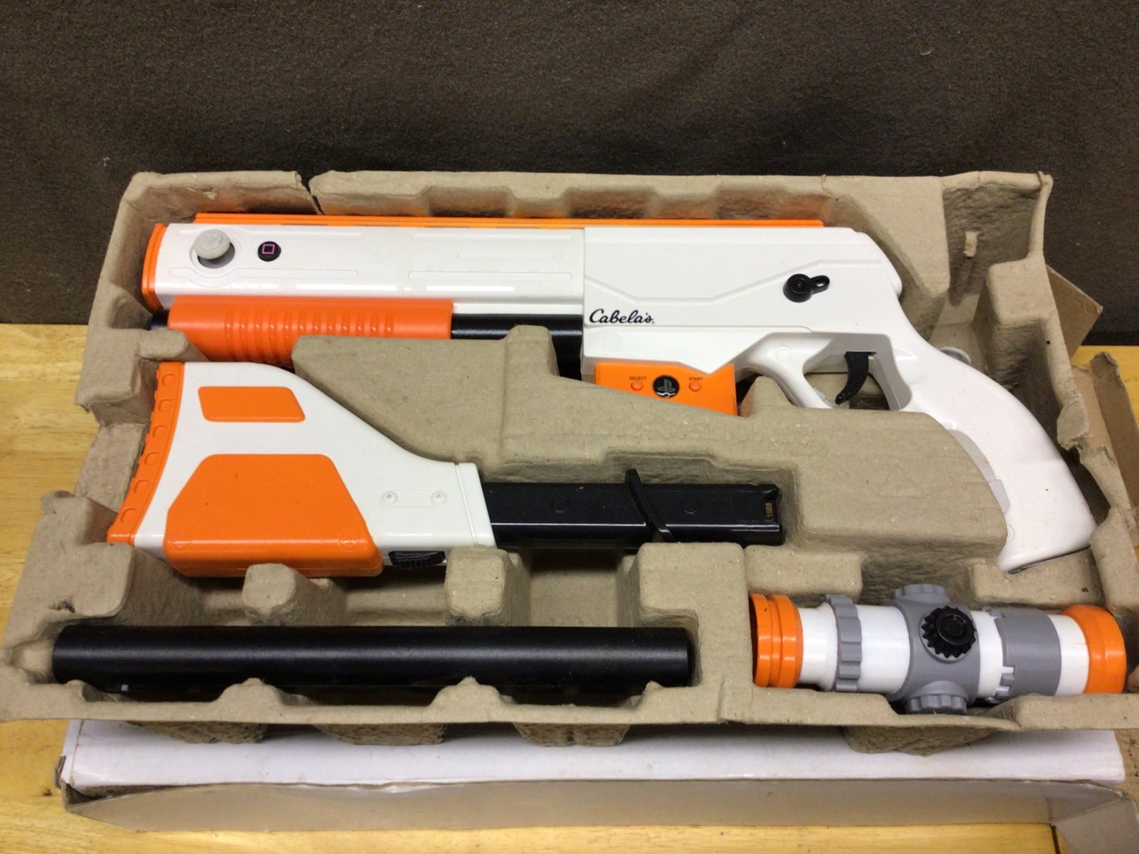 Cabela's Top Shot Elite Electronic Gun for PS3 with Scope: Cabela's Top Shot Elite electronic gun for PS3, model 76405800, with original packaging. Includes detachable stock, barrel, and scope; designed for use with the PlayStation 3 system. Manufactured in