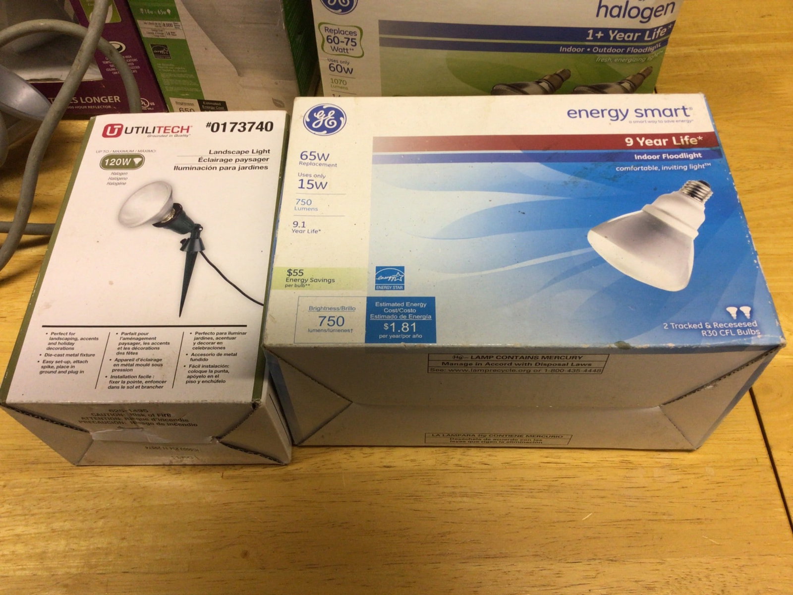 Floodlights by GE, TCP, and Utilitech: Various floodlights, including a GE Energy Smart 9-Year Life 65W Indoor Floodlight (model 44247), GE Halogen 1+ Year Life Indoor/Outdoor Floodlight 60W (model 46283), TCP 65W BR30 Soft White Bulbs