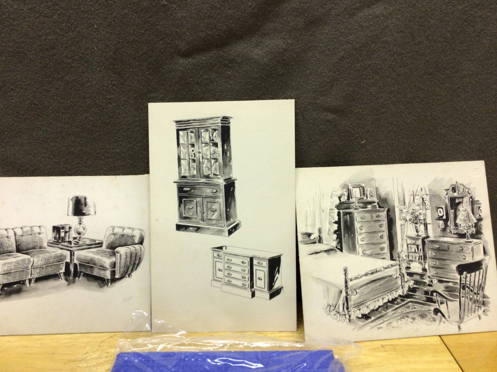 Three Furniture Illustration Prints and Blue Tarp Bundle: Three original black-and-white illustration prints depicting furniture arrangements, including bedroom, living room, and cabinetry scenes. Artwork dimensions approximate 14x11 inches. Accompanied by