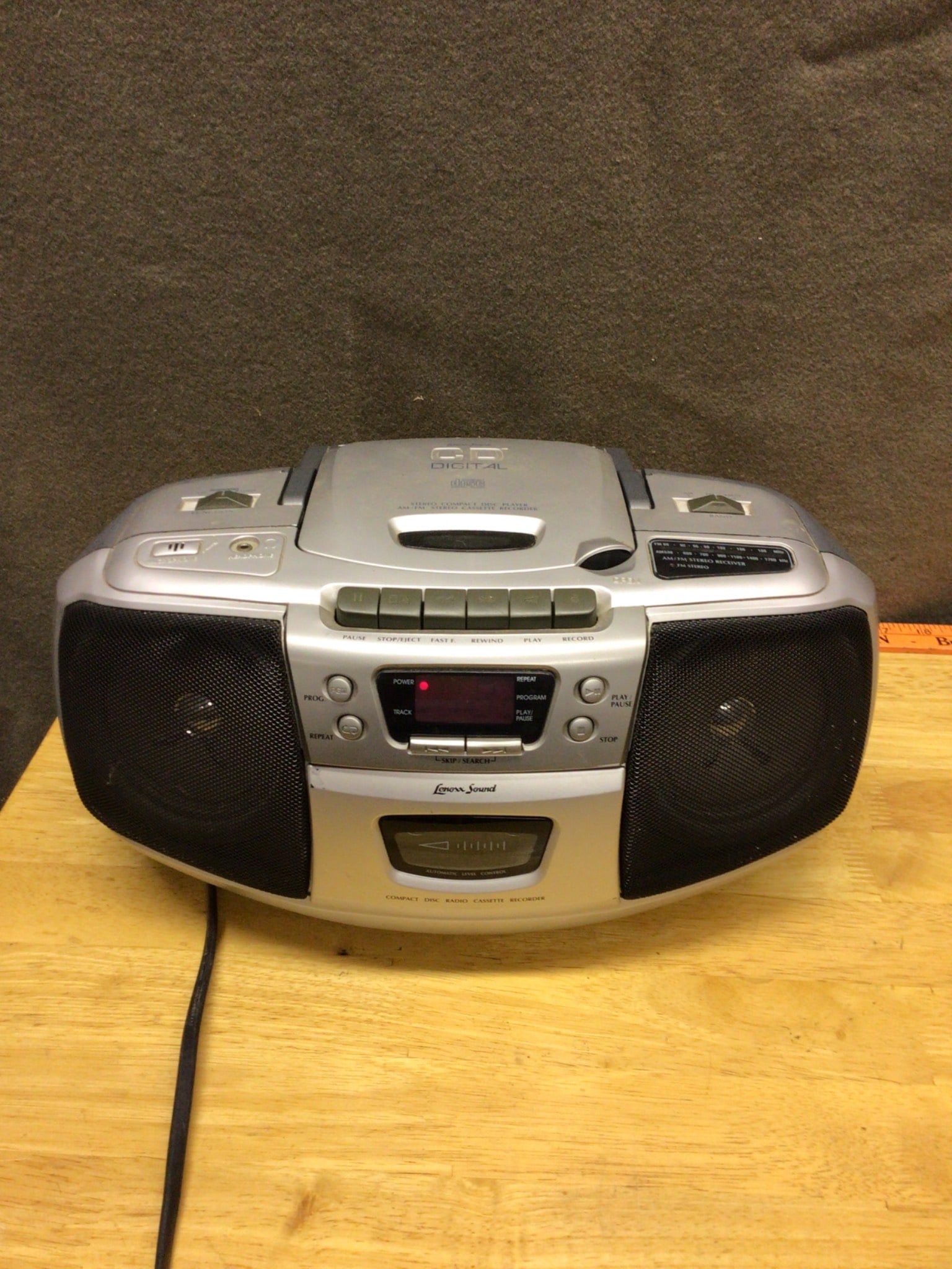 Jensen CD-540 Portable AM/FM Stereo Radio with CD Player and Cassette Recorder: Jensen CD-540 portable stereo system featuring AM/FM radio, CD player, and cassette recorder. Manufactured in October 2005, the unit includes a top-loading CD player and a front-facing cassette deck.