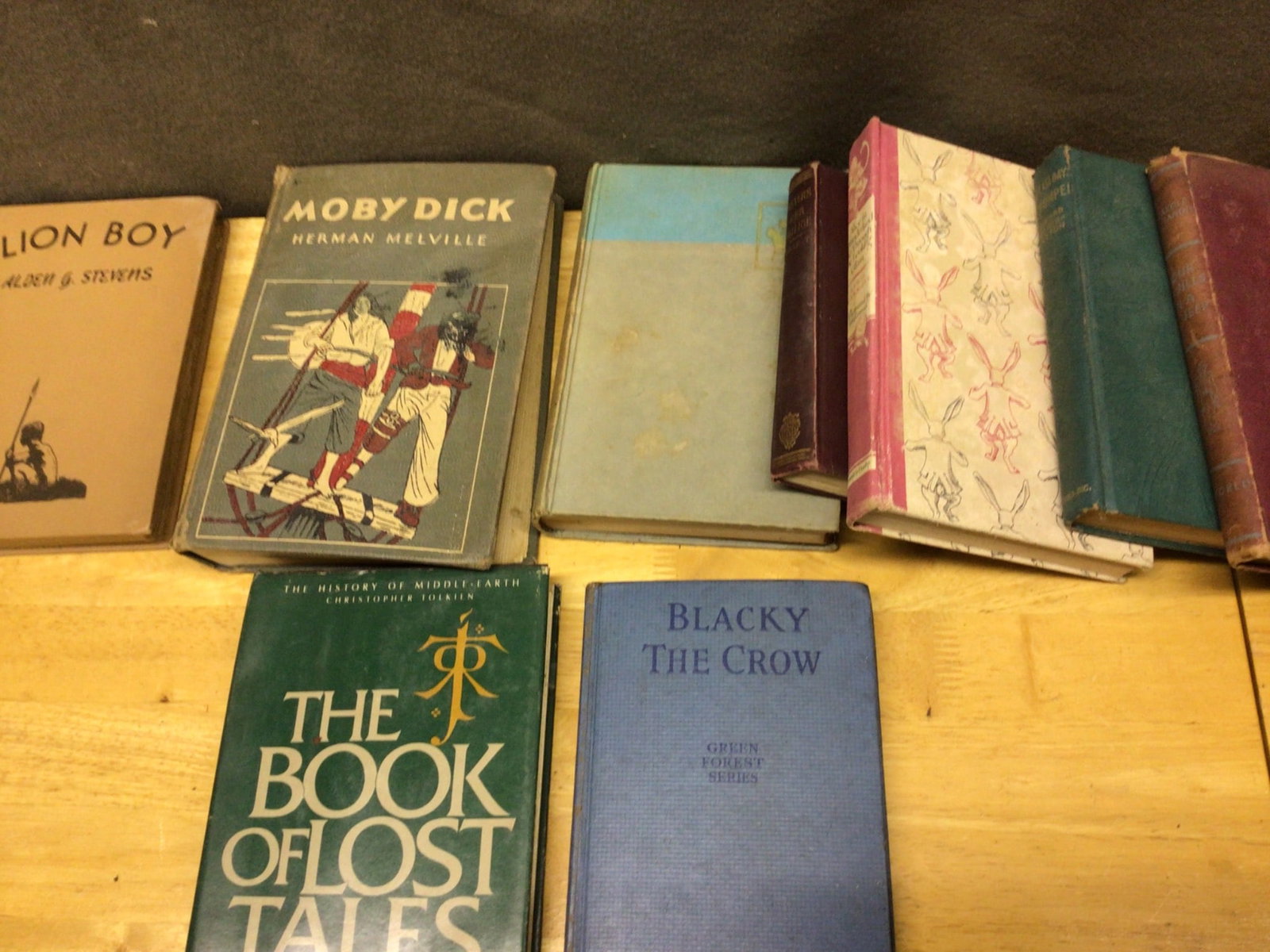 Hardcover Books, Featuring Works by J.R.R. Tolkien, Herman Melville, and Others: This lot includes a variety of hardcover books, including 'The Book of Lost Tales' by J.R.R. Tolkien, a volume from 'The History of Middle-Earth' series, 'Blacky the Crow' by Thornton W. Burgess from