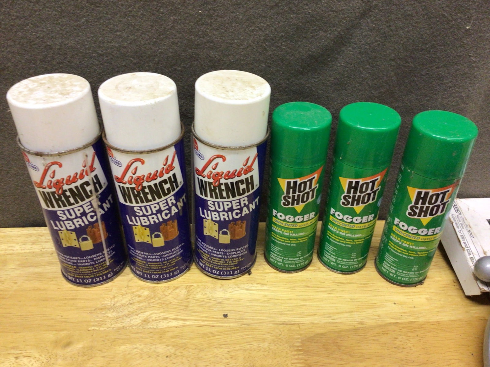 Tools and Accessories Including Liquid Wrench, Gloves, and RIDGID Hacksaw: This lot consists of six cans, including three Liquid Wrench Super Lubricants (11 oz each) and three Hot Shot Foggers (insecticides). It also includes two pairs of gloves: one leather work glove pair 