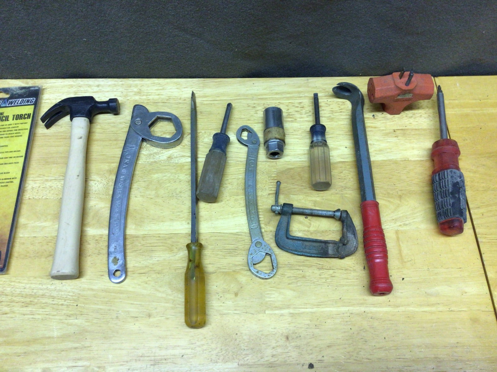 Hand Tools, Including Chicago Welding Pencil Torch: Various hand tools, including a Chicago Welding Butane Pencil Torch (sealed in the original packaging), a claw hammer, adjustable wrenches, flathead and Phillips screwdrivers, an L-shaped pry bar, a v