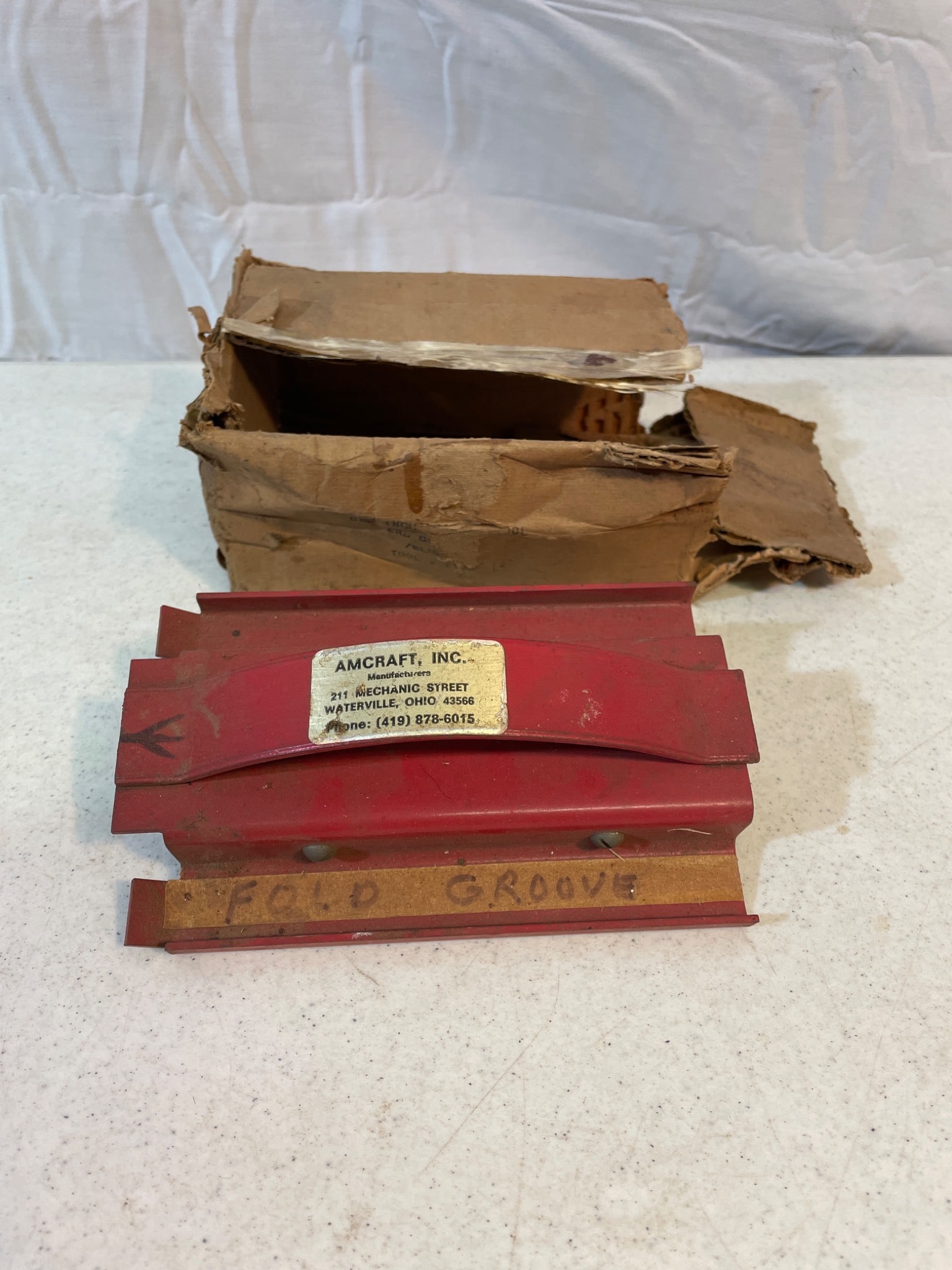 Red Metal Aircraft Structural Tool with Box by AirCraft, Inc.: Red Aircraft structural tool manufactured by AirCraft, Inc., model displayed: SPEED GROOVE. The unit retains original labeling and design. Includes original packaging, though with visible wear. This