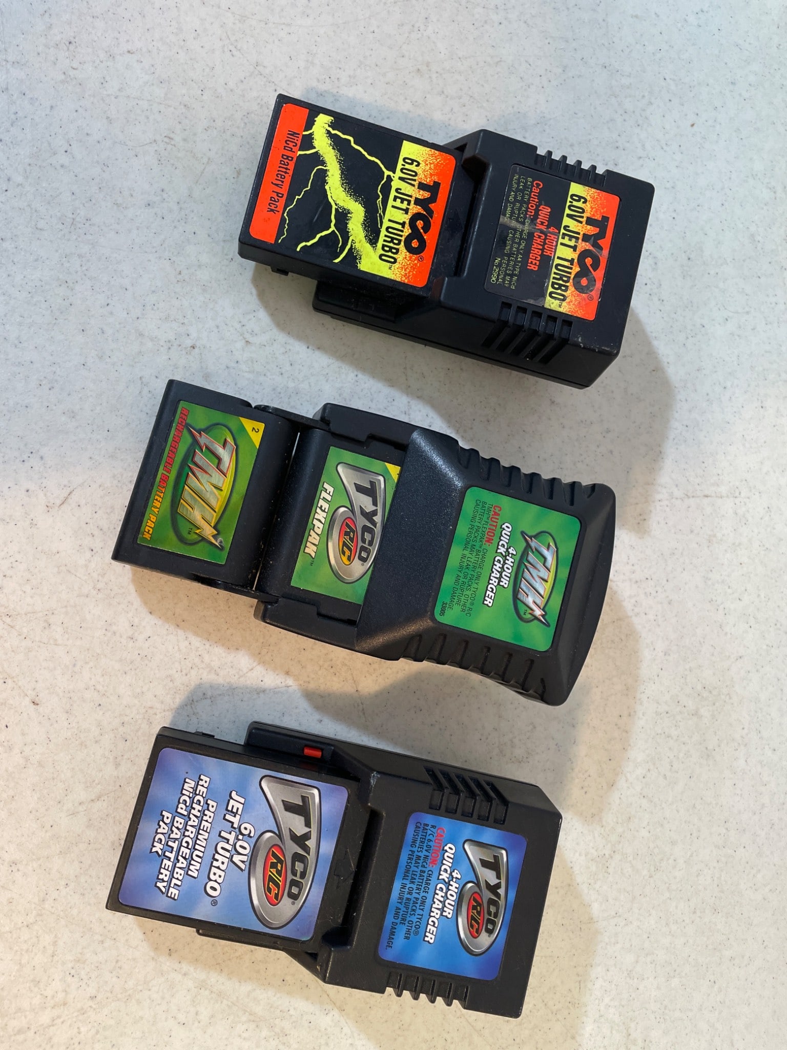 Tyco RC Battery Packs for Remote-Control Vehicles: This lot includes three Tyco RC battery packs designed for use with remote-control vehicles. Models include Turbo Twin 9.6V NiCd (2 units) and 6.0V NiCd (1 unit). These units are untested, as we had