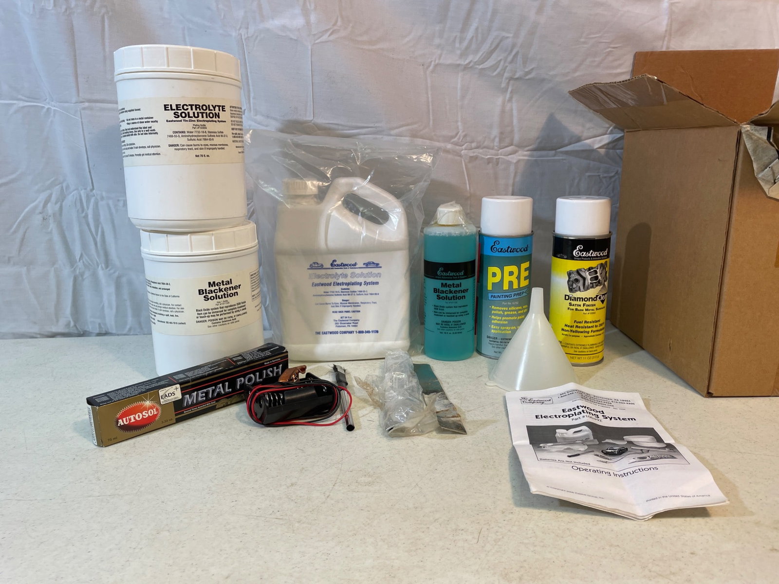 Eastwood Electroplating System, Part #10049Z, Complete Kit with Instructions: Complete Eastwood Electroplating System, Part #10049Z, includes all components as pictured: metal polish, electroplating solution, cleaning agents, application equipment, and user manual.