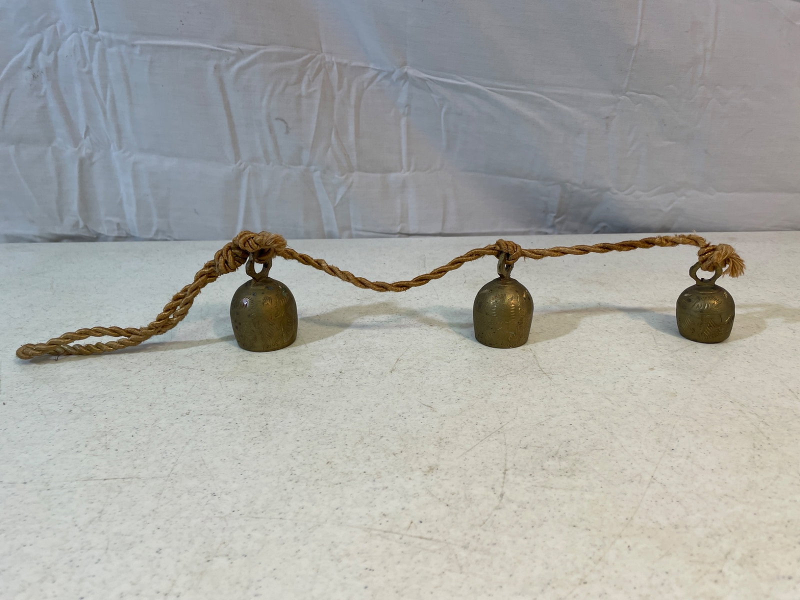 Three Brass Bells on Twisted Rope (1 of 2)