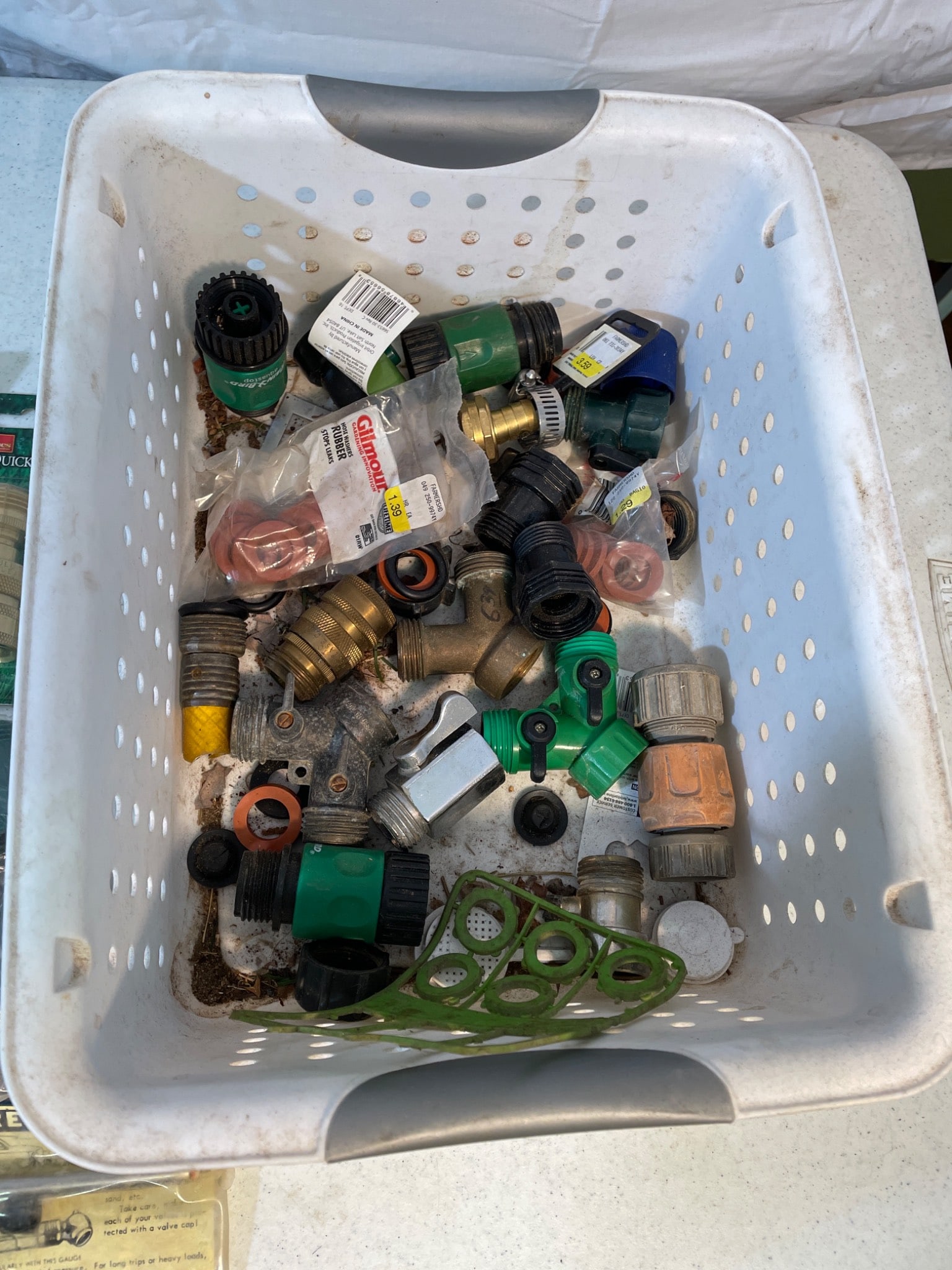 Automotive, Plumbing, and Hardware Tools and Accessories: This lot includes a variety of items such as reusable R-134a gauge and hose kits, lampholders, MiniCast brass connectors, tire repair kits, and a collection of hose fittings and connectors. Items are