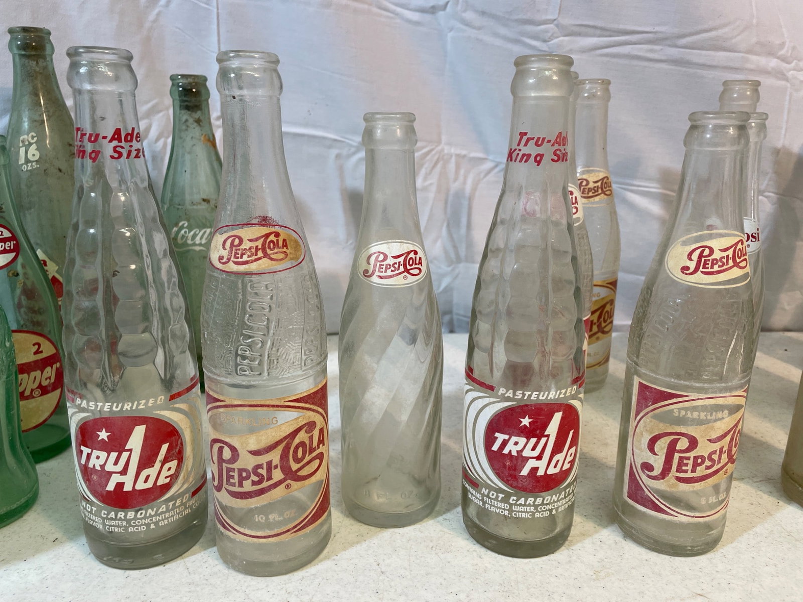 Vintage Soda Bottles Including Pepsi, Royal Crown, and Tru-Ade - 3