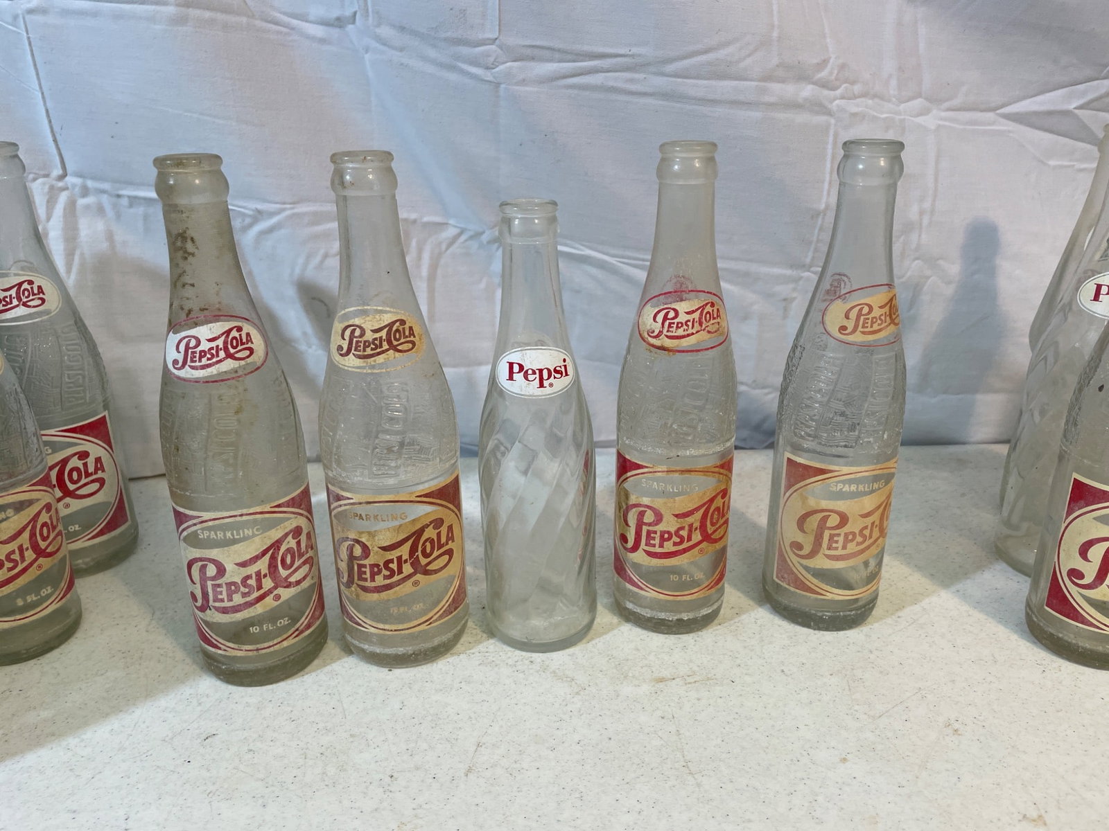 Vintage Soda Bottles Including Pepsi, Royal Crown, and Tru-Ade - 4