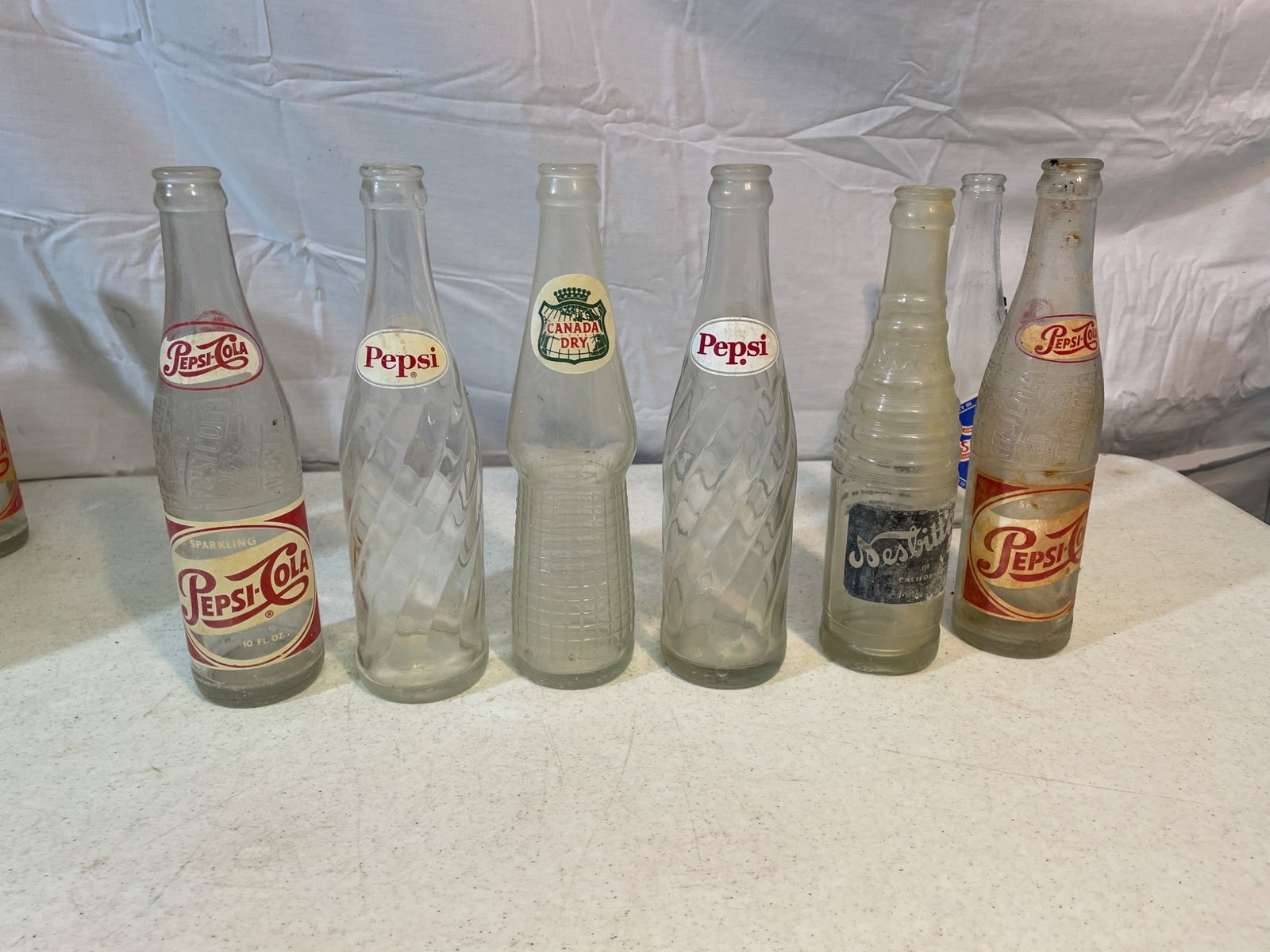Vintage Soda Bottles Including Pepsi, Royal Crown, and Tru-Ade - 5