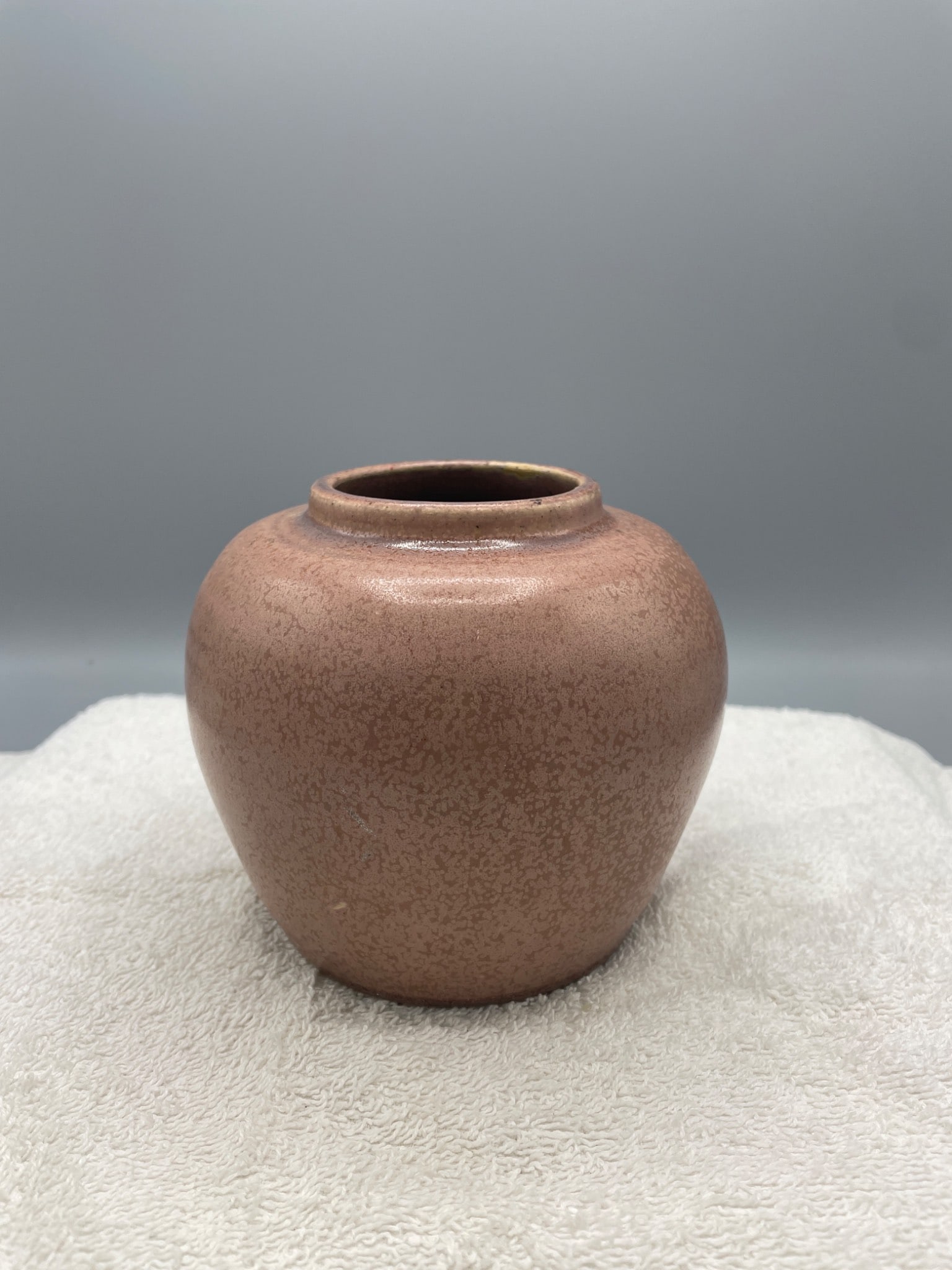 Cherokee Pottery Small Brown Jar with Maker's Mark: This small ceramic jar features a brown glaze with a mottled appearance and measures approximately 4 inches in height. The bottom bears a Cherokee Pottery maker's mark, indicating the origin of manufa