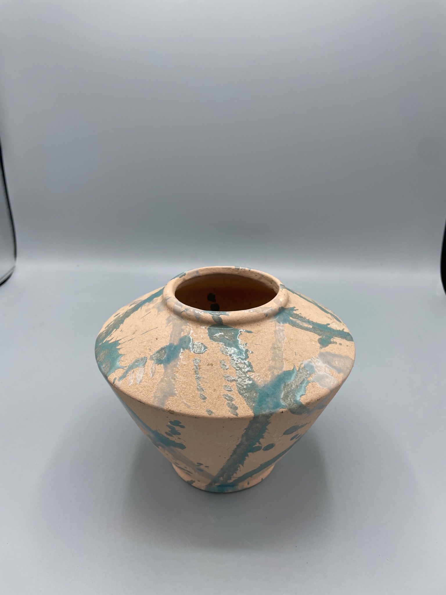 Planter Vase by Haeger Pottery, Made in USA, Beige With Green Glaze: This planter vase, manufactured by Haeger Pottery, features a beige finish with green glaze accents. The base bears the "Made in USA" Haeger mark, indicating production in Dundee, Illinois. The vase i
