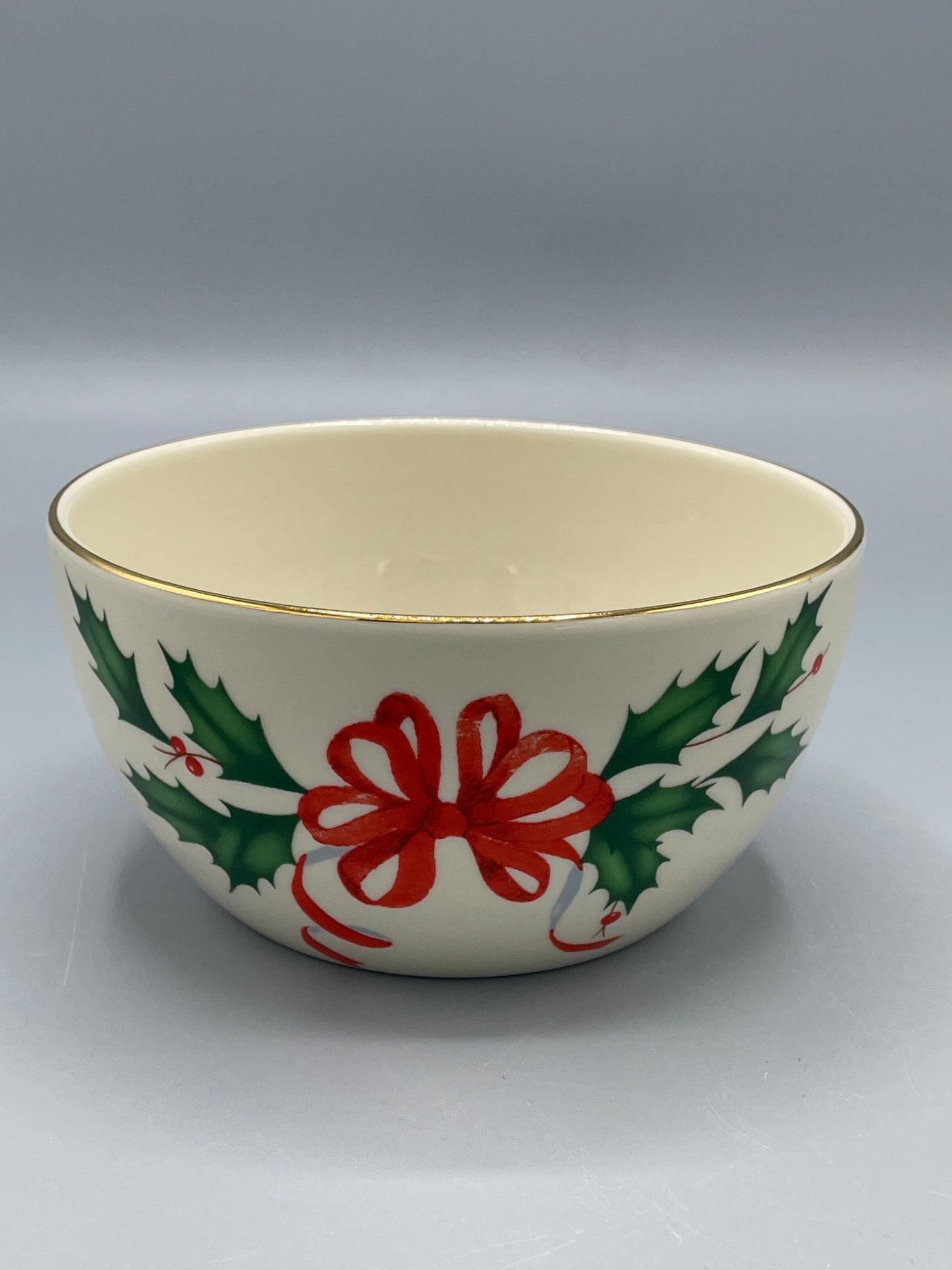 Lenox Holiday Bowl with Gold Accent Rim, 4-Inch Diameter: This ceramic Lenox bowl features the 'Holiday' pattern, with holly and ribbon designs, and a gold-accented rim. Marked on the bottom with 'Lenox,' 'Holiday,' and 'Dishwasher Safe,' it measures