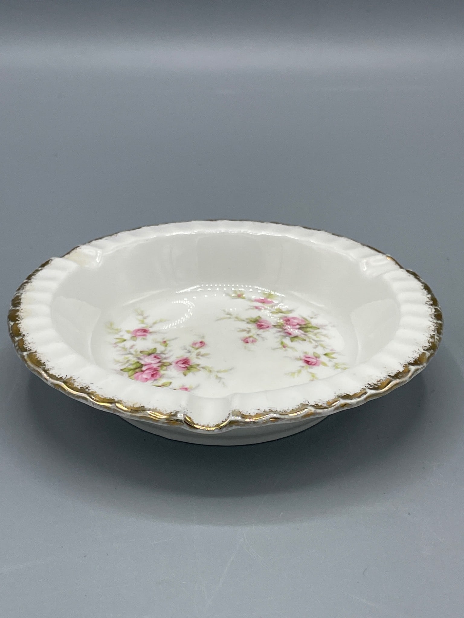 Paragon Fine Bone China 'Victoriana Rose' Dish with Gold Trim, Made in England: This Paragon fine bone china dish, marked with the pattern 'Victoriana Rose,' was made in England. It features gold trim and a floral design of pink roses. The marking indicates it was produced under 