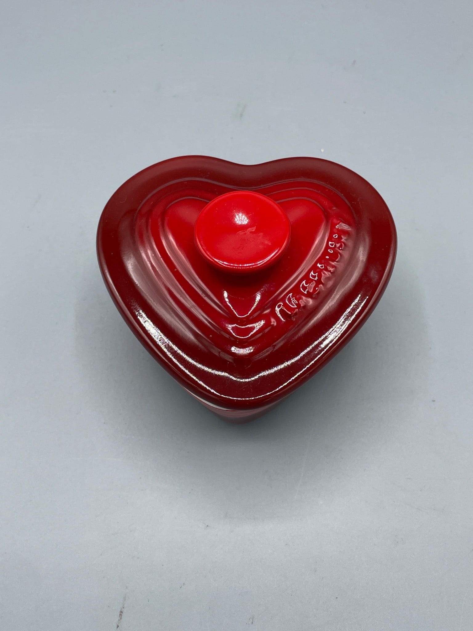 Le Creuset Heart-Shaped Stoneware Dish with Lid, Marked 0641: Le Creuset heart-shaped stoneware dish with red glaze and matching lid. Marked on the base with â€˜0.6.41â€™ and â€˜Le Creusetâ€™. Mea