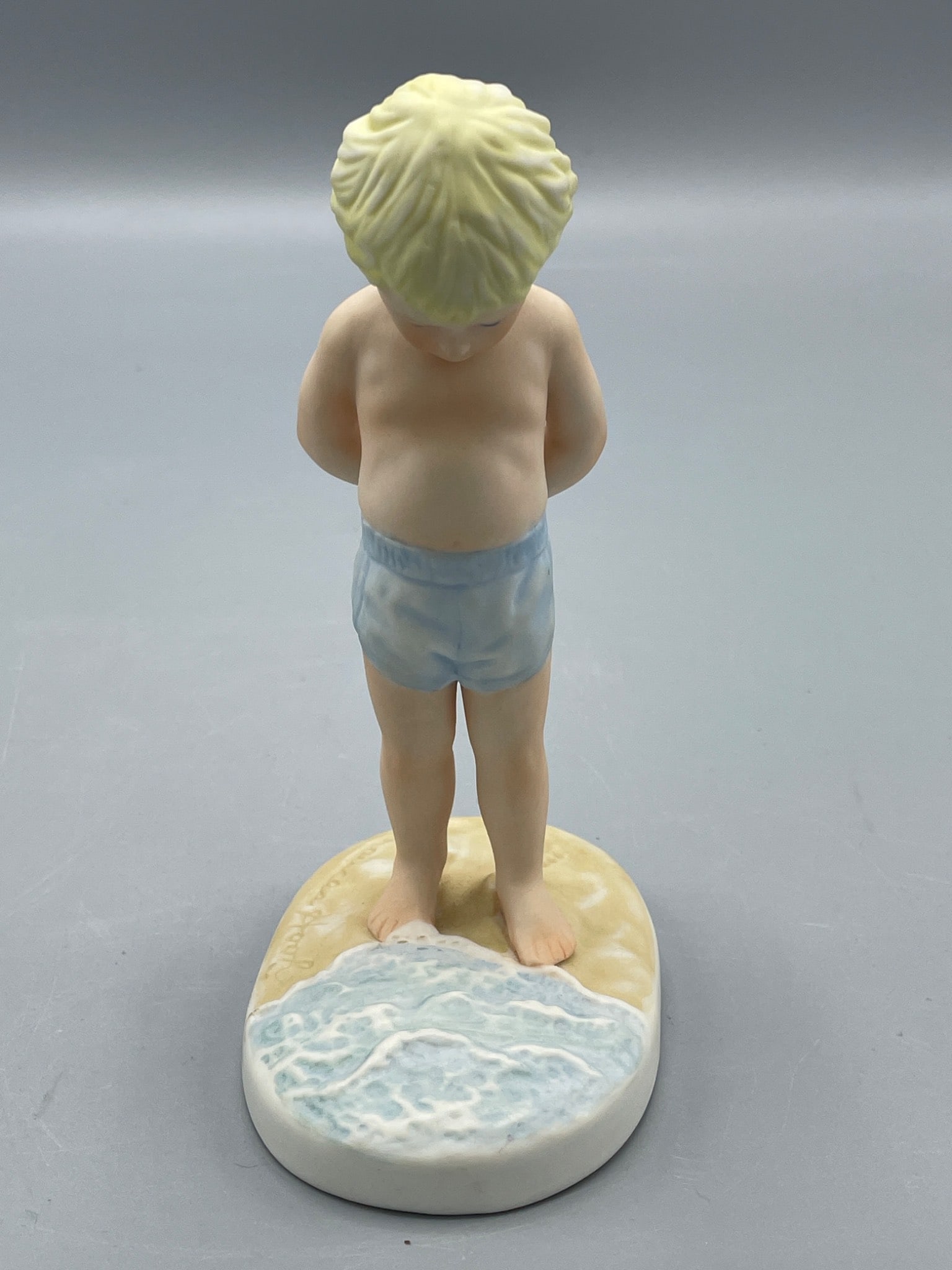 1980 Ceramic Figurine 'The Sea and Me' by Frances Hook for Roman Inc.: This ceramic figurine titled 'The Sea and Me' is part of the 'A Child's World' collection by Frances Hook. Created exclusively for Roman Inc. by Ceramica Excelsis in 1980, it measures approximately 6
