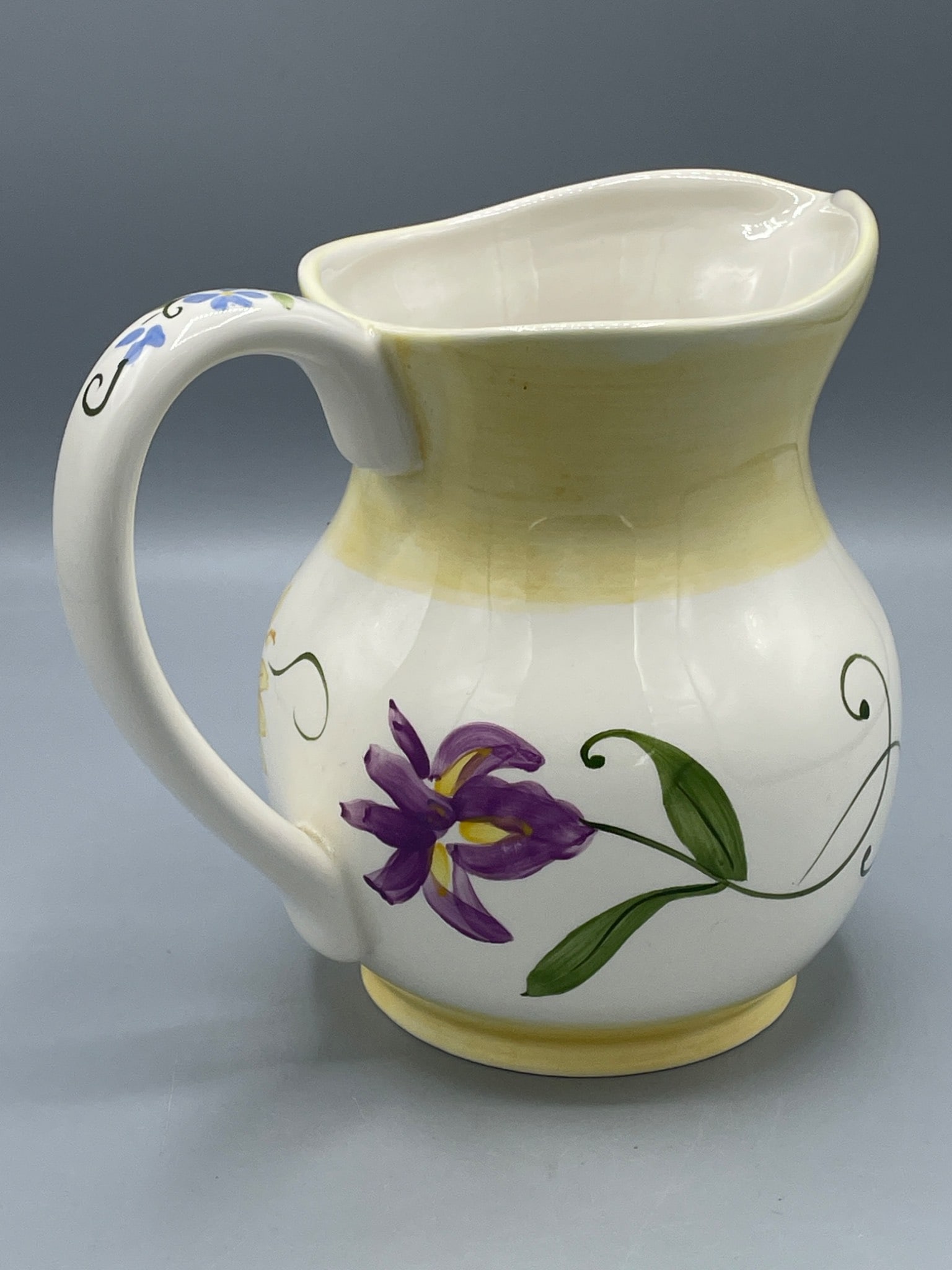 FTD 'A Gift From' Ceramic Pitcher with Floral Design - Made in China: This is a ceramic pitcher labeled 'A Gift From FTD,' originating from China. The pitcher features a hand-painted floral design with various flowers and decorative scrollwork. It stands approximately 6