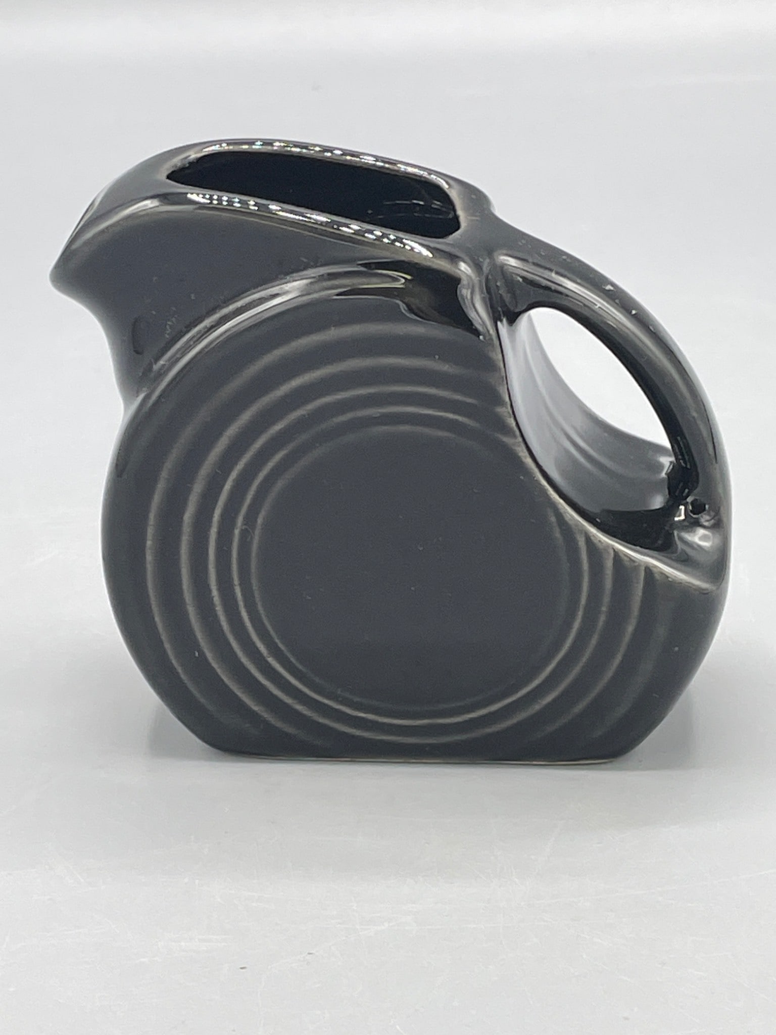 Fiesta Black Ceramic Pitcher With Embossed Mark on Base - 2