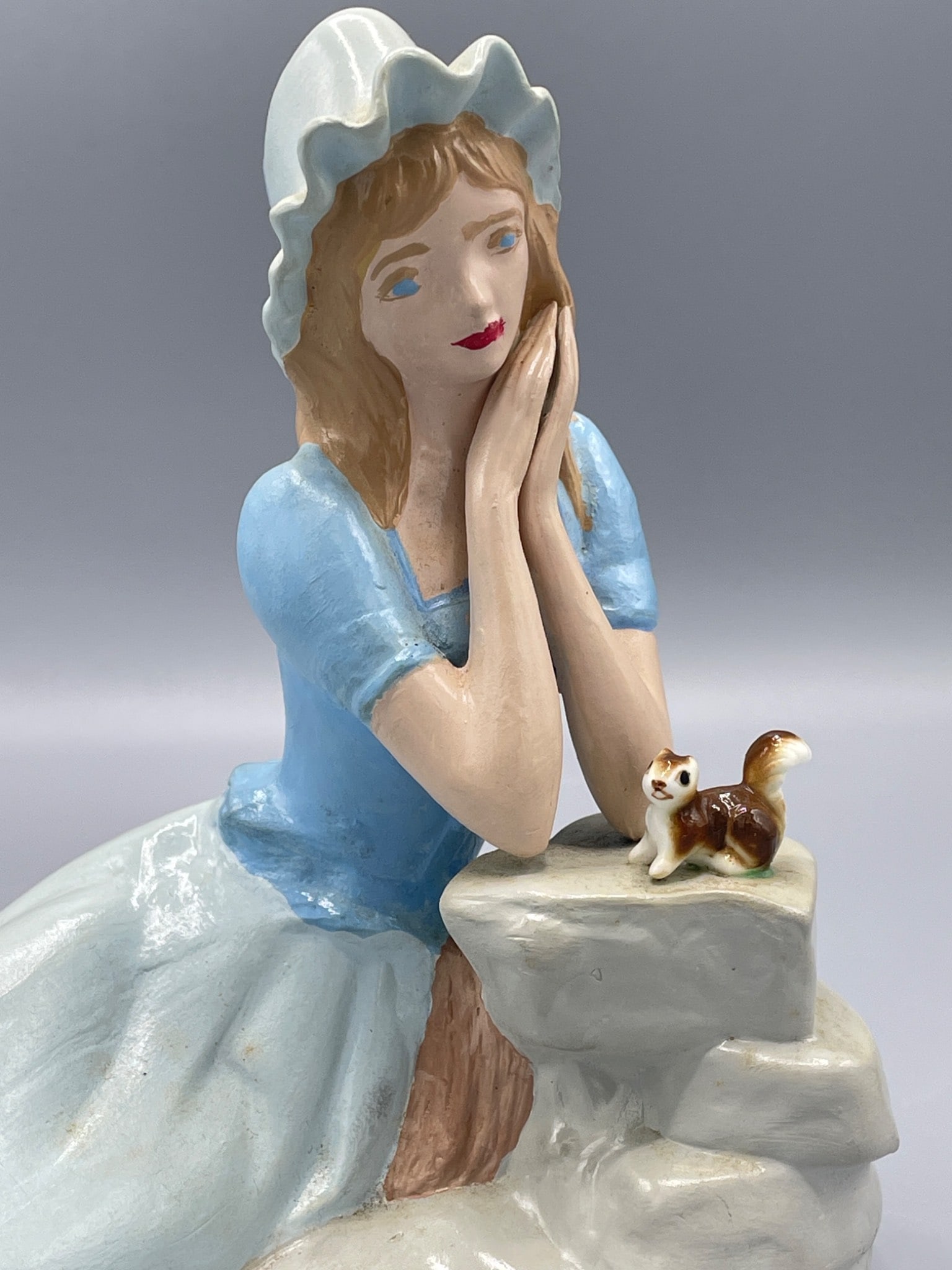Hand-Painted Ceramic Figurine of Woman With Bonnet and Cat on Rock Formation - 2