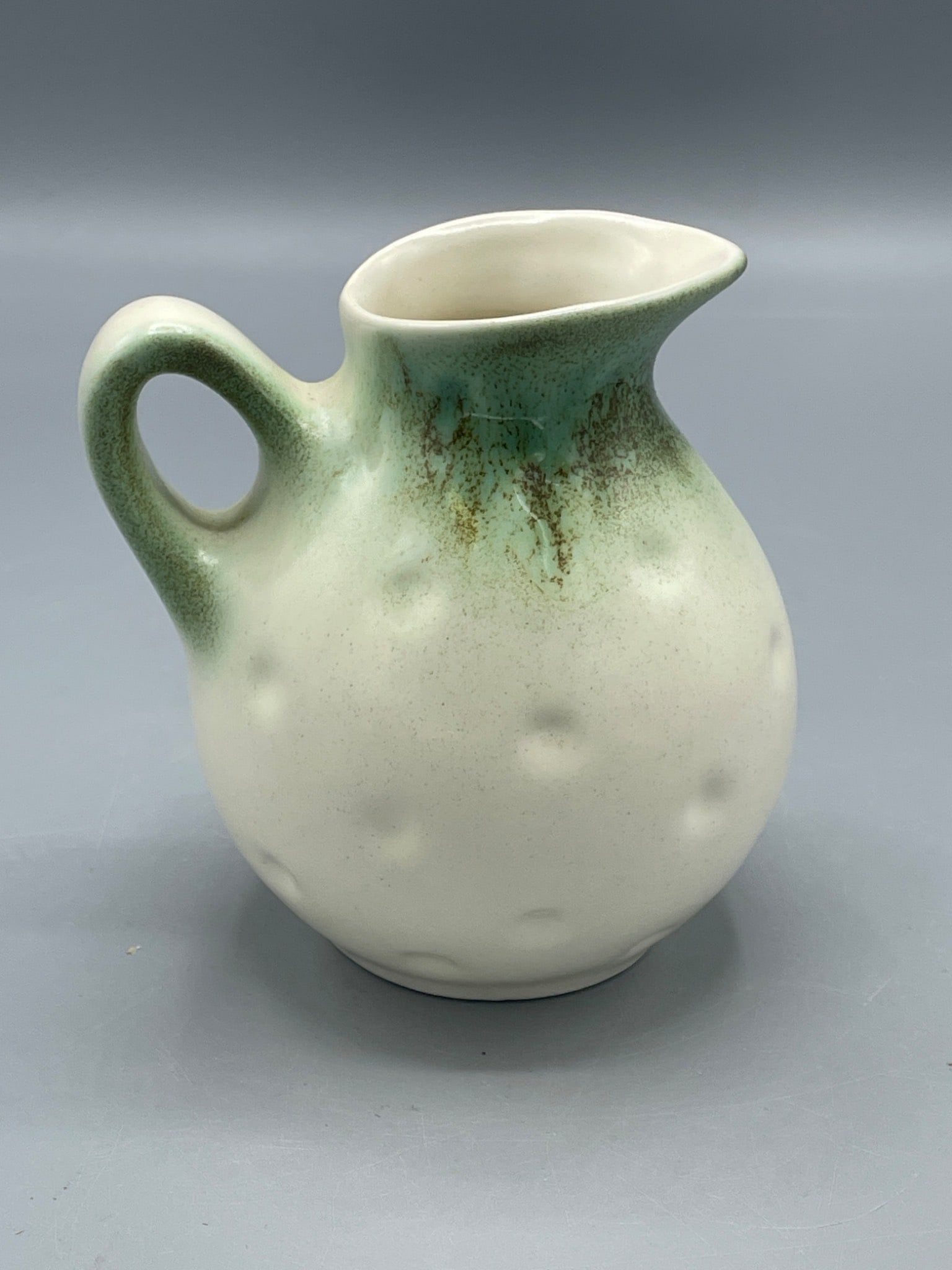 Small Ceramic Creamer with Green Glaze and Textured Surface (1 of 5)