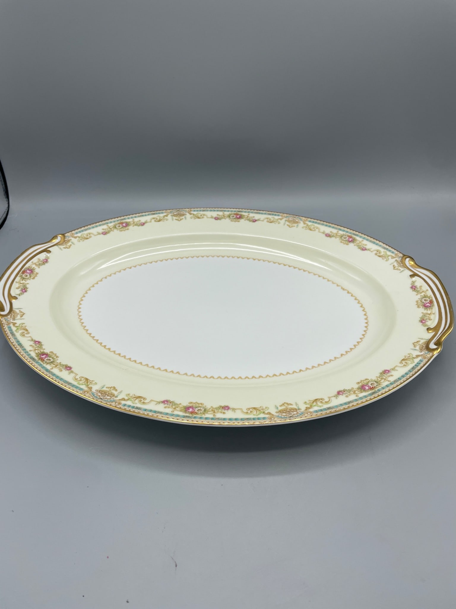 Noritake China Serving Platter Made in Occupied Japan with Floral and Gold Accents: This is a porcelain serving platter by Noritake China, marked 'Made in Occupied Japan.' It features floral and gold accents with intricate detailing around the edges. The platter measures