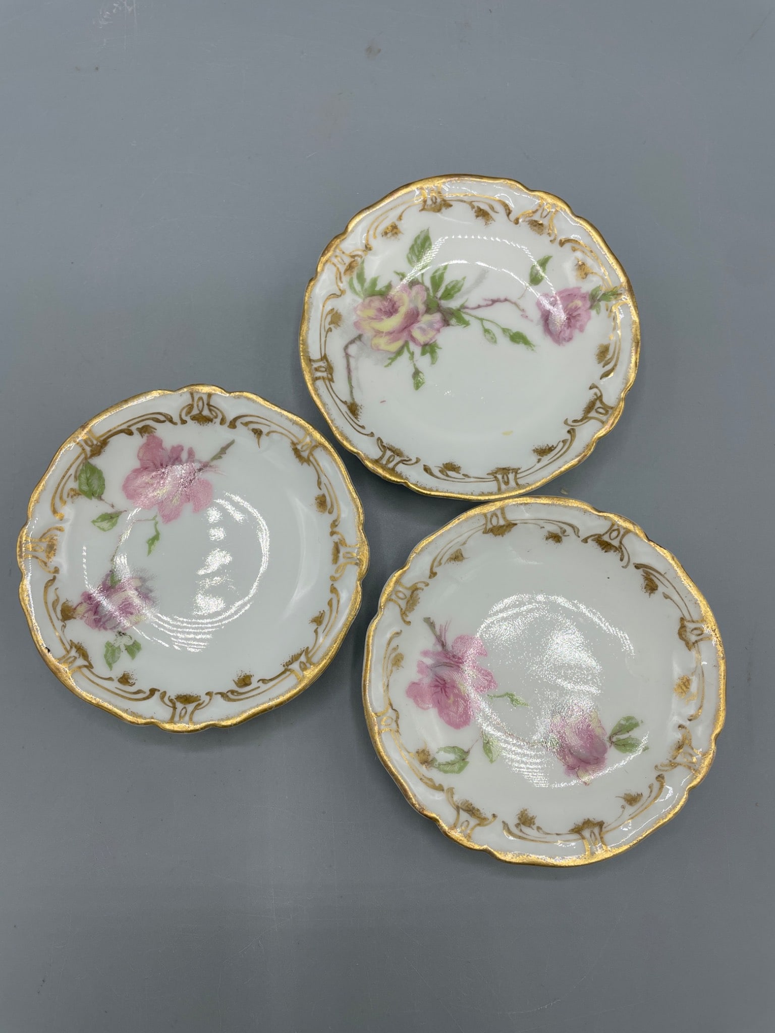 3 Haviland & Co. Plates for Wright Tyndale & Van Roden: This lot includes a set of 3 porcelain plates manufactured by Haviland & Co., France, expressly for Wright Tyndale & Van Roden. Each plate features floral motifs with gold accents and scalloped
