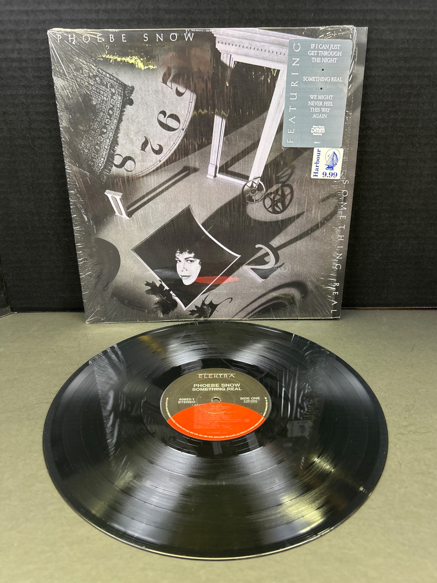Phoebe Snow 'Something Real' Vinyl Record LP, Columbia C 40663: Vinyl record LP of 'Something Real' by Phoebe Snow. Released by Columbia with catalog number C 40663. Includes original album artwork and shrinkwrap partially intact. Condition of the vinyl appears